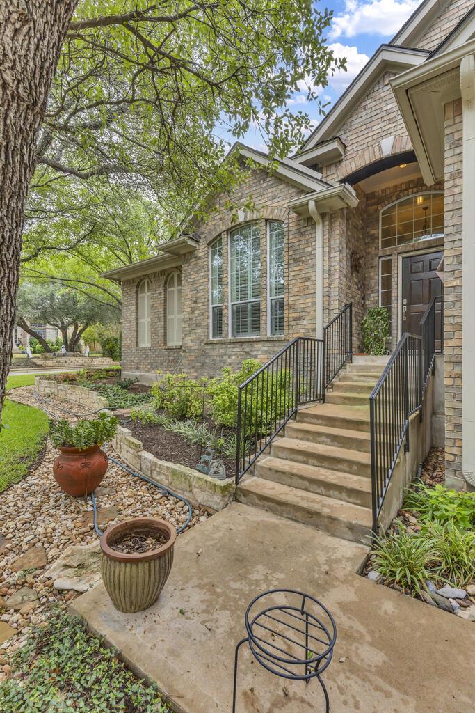 Experience refined living in Steiner Ranch at 12824 Rush Creek Lane. Situated on a sprawling corner lot framed by majestic oak trees and stunning landscaping, this beautifully appointed home blends elegant interiors with an exceptional setting. Featuring three bedrooms, two full baths, a half bath, and a two-car garage, the home also offers a spacious office with a closet that could serve as a fourth bedroom.  An expansive open floor plan creates an inviting backdrop for effortless entertaining, with generous living and dining spaces that flow seamlessly for intimate dinners and larger gatherings alike. Numerous upgrades, rich hardwood and tile flooring, and timeless wood shutters bring warmth, sophistication, and enduring style throughout.  Ideally located toward the scenic end of Steiner Ranch, close to the Lake Austin boat ramp, this home makes afternoons on the water part of the lifestyle. Enjoy convenient access to shopping, restaurants, neighborhood amenities, and highly regarded Leander ISD schools. From its gracious interiors to its beautifully landscaped grounds, this exceptional property offers an elegant balance of comfort, privacy, and everyday luxury.