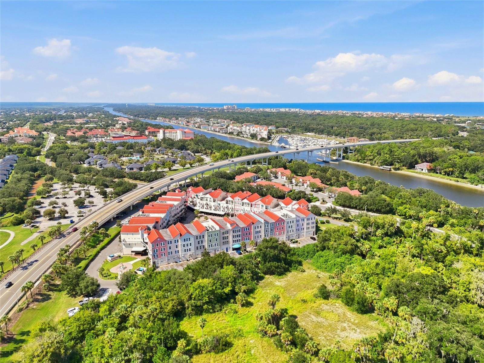 Under contract-accepting backup offers. A DISTINCTIVE TOP-FLOOR CORNER PENTHOUSE in European Village’s sought-after B Building. Residence 418 combines dramatic architecture, soaring ceilings and exceptional natural light with the flexibility of a private Palm Coast retreat or established vacation rental.Eight large windows, 10-foot ceilings and elegant tray ceiling details create an impressive sense of space in this beautifully maintained one-bedroom, one-and-a-half-bath residence. The architectural showpiece is the turret-style breakfast nook, wrapped in three soaring arched windows beneath a dramatic cathedral ceiling rising approximately 20 feet, with views toward the European Village fountain. A spacious primary suite with private bath and two walk-in closets completes the interior.Step outside to your private balcony overlooking the European Village courtyard—an inviting outdoor living space above the heart of the Village.For investors, Residence 418 is currently operating as a successful short-term rental recognized among the Top 5% of eligible homes on Airbnb. Continue its established vacation-rental use, enjoy it as your own Palm Coast getaway, or combine personal use with rental income potential.Downstairs, enjoy European Village’s restaurants, cafés, shops, live entertainment and Sunday Farmers Market. Across the street are the Intracoastal Waterway and scenic St. Joe Walkway for walking, fishing, birdwatching and dolphin watching. Golf is just down the road, and Palm Coast’s beaches are only a short drive across the bridge.Recent updates include a brand-new LG stacked washer and dryer and newer filtered tankless water heater. One garage parking space with dedicated storage is included. Offered unfurnished; furnishings are negotiable.Architecturally distinctive, light-filled and beautifully cared for, Residence 418 offers a rare combination of lifestyle, location and investment flexibility in the heart of Palm Coast.