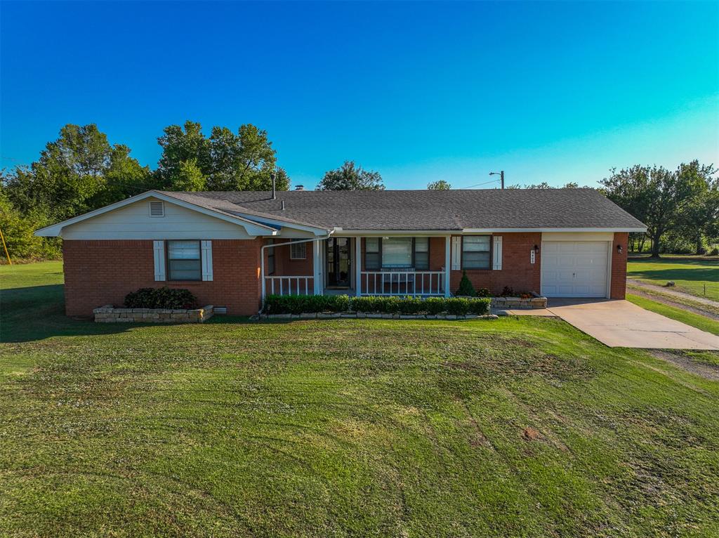 +/-2 Acres in OKC, rare, but here it is! 3 bedroom 2 bath home sits quietly waiting for a new owner. This brick charmer as been well loved over the years and recently had a fresh coat of paint. Combination of flooring types include tile and immaculately kept carpet. Step out the back door onto the covered porch to enjoy the space. The lot is well maintained and offers with the home a separate garage with 2 bays and a work space, if that isn't enough there are two other barns on the property. 

2 acres isn't enough? Check out the listing next door to add 3.2 to it.