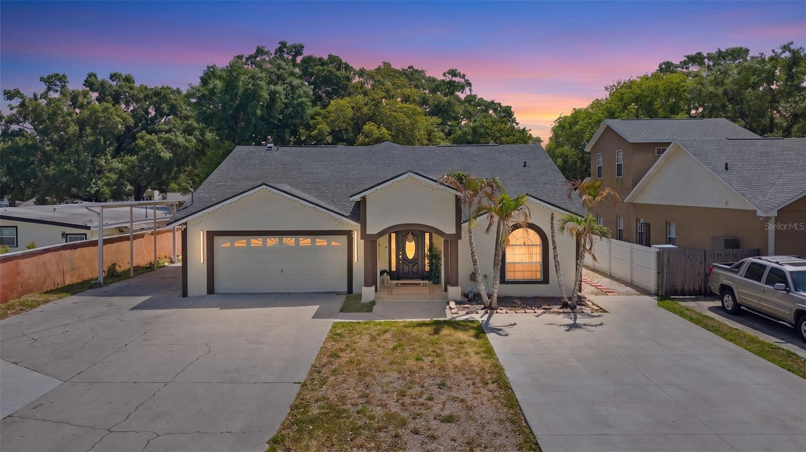 Nestled in the 33614 zip code of Tampa, this breathtaking 5-bedroom, 3.5-bath estate exudes elegance and sophistication. Spanning over 3,100 square feet under air and a total of 4,190 square feet, it has been fully remodeled inside and out. The home showcases a brand-new $45,000 kitchen, soaring 14-foot cathedral ceilings, and a completely new roof. The interior and exterior have been freshly painted, offering a pristine ambiance. Outside, a driveway accommodating up to 10 vehicles and a side carport ensure ample space. The expansive 0.34-acre lot features an exterior kitchen, a half-bath, and RV hookups, while the backyard is ready for a dream pool. This is more than a home—it’s a luxurious retreat, ready to create your next chapter of cherished memories.
