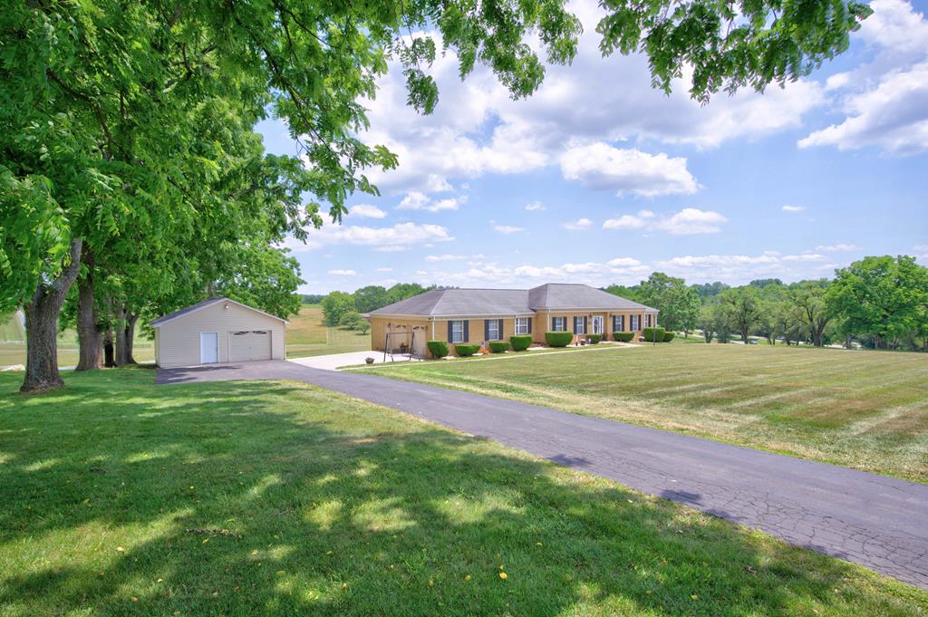 Welcome to one of Pulaski County's most sought-after neighborhoods, where you can now make this dream home your reality! If you're searching for the perfect location, look no further. This exceptional property is nestled atop Pulaski County High School and Pulaski Middle School, conveniently located just minutes away from the heart of town and all the amenities you could need. This stunning 3-bedroom, 2-bathroom home boasts a thoughtfully designed floor plan, spacious rooms, and a dedicated laundry room. For added security, there's a built-in gun safe, and you'll have the convenience of an attached two-car garage and a detached one-car garage. But YA'LL... the BEST highlight of this property is the breathtaking views from the back porch! Imagine sipping your morning coffee while gazing over the sweet one acre pond below. This place has been meticulously maintained, and the entire neighborhood screams cleanliness and charm. Don't miss out on this incredible opportunity to own in here!!