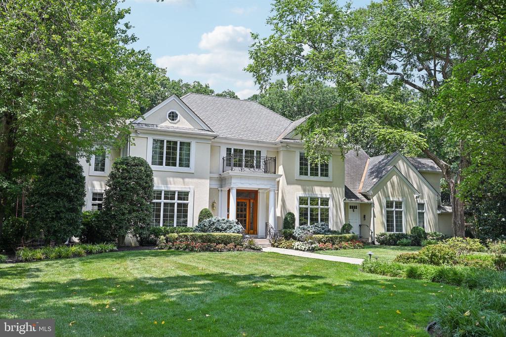 Enter the long, winding private drive  that stirs anticipation, unveiling a magnificent custom-built 6,200 sqft estate surrounded by breathtaking natural beauty.  Nestled on a secluded 3.7-acres of  manicured treed grounds, this spectacular home is a showcase of quality craftsmanship, stunning built-ins, and luxurious amenities throughout. Step into the dramatic Foyer and experience the grandeur that defines every room. Entertain guests in the breathtaking grand Ballroom, complete with a custom mahogany wet bar, wood-burning fireplace, oak parquet flooring, speaker system with subwoofer—perfect for elegant gatherings. The chef’s kitchen is a culinary dream, featuring ample Clive Christian cabinetry, top-tier appliances including a Wolf oven with warming drawer, Sub-Zero refrigerator with 2 drawer freezers, and Bosch and Miele dishwashers, 2 wine refrigerators.  all set against marble countertops and flooring. The Kitchen opens to a striking English Breakfast Room with radiant heated flooring offering serene views of the wooded grounds. Adjacent is a cozy Family Room with soaring cathedral ceilings, a stone fireplace, and skylights that bathe the space in natural light. The stately Library impresses with rich, raised walnut-stained poplar paneling and wood flooring, plus a charming fireplace, ideal for quiet reflection or remote work. On each side of the Foyer are the elegant Greeting Room and formal Dining Room adorned with hand-painted walls and ceiling with 24k gold trim, complimented by a classic fireplace for an unforgettable dining experience.  Upstairs, the expansive Primary Suite is a private retreat, featuring a fireplace, an oversized walk-in dressing area, and fully customized walk-in closets. The ensuite bath includes a steam shower for ultimate relaxation. The 2nd and 3rd front adjoining bedrooms have private baths, walk-closets and private balconies.  A 4th upper level bedroom sits directly across from an expansive updated bath with radiant heat flooring, heated towel rack and modern walk-in shower.  The extraordinary Lower Level features 2000 sq. ft. of finished living space, complete with In-Law or Au Pair suite with a full kitchen, living area, Bedroom , patio, full bath and closet storage.  A Wine Room with coffered ceilings, exhaust fan for cigar smoke and historical door from the 1st Quaker bank in 1889 at 721 Chestnut Street provides the perfect space for entertaining.  The 2000 sq ft. unfinished section of the basement offers space for storage. Additional features include a brand new septic system, 2 brand new HVAC units,  elevator, whole-house generator, 3 car garage and a circular driveway. This unparalleled estate is a legacy property, blending luxury, quality craftsmanship and the tranquility of exceptional living in one of the most beautiful and prestigious towns in South Jersey with excellent, top-rated schools and a charming downtown.  Stop Dreaming .. Start Living. Plus there is Room for a Pool...