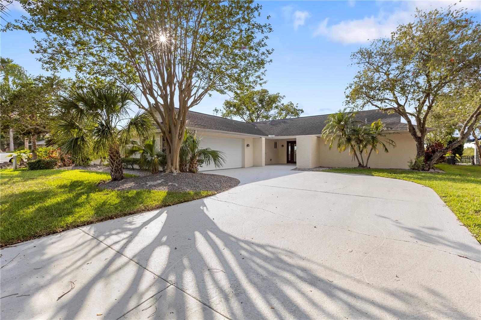 Waterfront Elegance and Coastal Living in New Port Richey.

Welcome to a serene waterfront escape where modern luxury meets laid-back coastal charm. This beautifully updated 3-bedroom, 2-bathroom home offers 2,086 sq ft of refined living space with tranquil water views and direct Gulf access—all just minutes from downtown New Port Richey.

Step inside to discover a bright, open layout with ceramic tile flooring throughout and carefully curated custom finishes. The gourmet kitchen is a standout, featuring Roma Gold quartz countertops, custom white oak cabinetry, stainless steel appliances, and captivating water views that carry through to the living room and primary suite.

The spacious primary bedroom offers a peaceful retreat with private water views and direct access to the lanai. Two additional bedrooms provide flexibility for family, guests, or a home office. Both bathrooms feature elegant custom tilework, adding a touch of luxury to everyday living.

Step outside and embrace the Florida lifestyle with a screened-in lanai, pool and jacuzzi, and a 2025 refurbished boat lift with new controller—all situated on a deep canal with quick access to the Gulf. Whether you’re enjoying a sunset cruise, a poolside gathering, or a quiet morning coffee, this backyard is designed for relaxation and recreation.

Extensive upgrades completed in 2025 include:
Elevated AC condenser, New electrical panel, New water heater, New pool pump, New garage motor, track, and door, Fresh interior and exterior paint, Updated landscaping

Set in a prime location just minutes from downtown New Port Richey’s shops, dining, and cultural venues, as well as Green Key Beach, Eagle Point Park, and the Suncoast Trail.

This is more than a home—it’s a coastal lifestyle redefined. Schedule your private tour today and discover waterfront living at its finest.