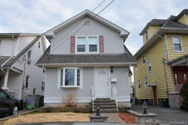 "Turn-key", meticulously maintained & ready for you to make this your home! Experience 1,500 sq. ft. of pristine living space with an extra 600 sq. ft of attic space which can be finished in this 3-bedroom, 2&1/2-bathroom home where pride of ownership shines in every detail. The interior features gleaming hardwood floors and an abundance of storage, including a full basement and easy-access stairs to a spacious attic. A private driveway adds rare convenience to this beautifully cared-for property. This home stands out for its continued maintenance and recent mechanical updates. Enjoy a 2025 main water line replacement, brand-new 2026 window screens, and a suite of newer appliances including a 2022 dishwasher and 2021 washer, dryer, and hot water heater. The central AC and heating systems have been professionally serviced every year since installation, ensuring peak performance. The exterior is designed for low maintenance and high enjoyment, featuring siding and windows from 2008 and a roof approximately 10 years old. Step out onto a private deck—refurbished in 2024—overlooking a lush backyard perfect for entertaining. This "very loved" home is ready for its next owners!