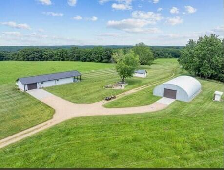 Income, Privacy, Serenity & Comfort -- All on 618 Acres in Stone/Barry Counties!Discover an exceptional property that blends income opportunity, recreational enjoyment, and sustainable living. This 618-acre farm offers a rare combination of hay production, timber potential, and premier hunting grounds -- all with unmatched privacy and serenity.&#10024; Key Features:Income Potential: Established hay production with additional opportunity for timber income.Recreational Paradise: Prime habitat for deer and turkey hunting -- easily developed into a private hunt reserve.Chemical-Free Legacy: No glyphosate used on the farm for at least 35 years (verifiable).Workshop/Barn: A metal arched workshop, fully insulated with sprayed-on closed-cell foam, easily convertible into a barn.RV & Equipment Ready: Three 50-amp charging stations for RVs or power equipment.&#127969; The Home:Highly energy-efficient construction with sprayed-on open cell foam insulation.Thoughtfully designed with no vents, tubes, or penetrations through the roof, eliminating leak risk.Radiant floor heating via tankless water heater.Home has filtered water everywhere.Home conducts complete filtered air exchange every 15 minutes via Energy Recovery Ventilator System.Built to maximize comfort, efficiency, and long-term durability.Guest house comfortably sleeps six.This is more than just a property -- it's a self-sufficient retreat with a proven record of productivity, eco-conscious stewardship, and endless potential.