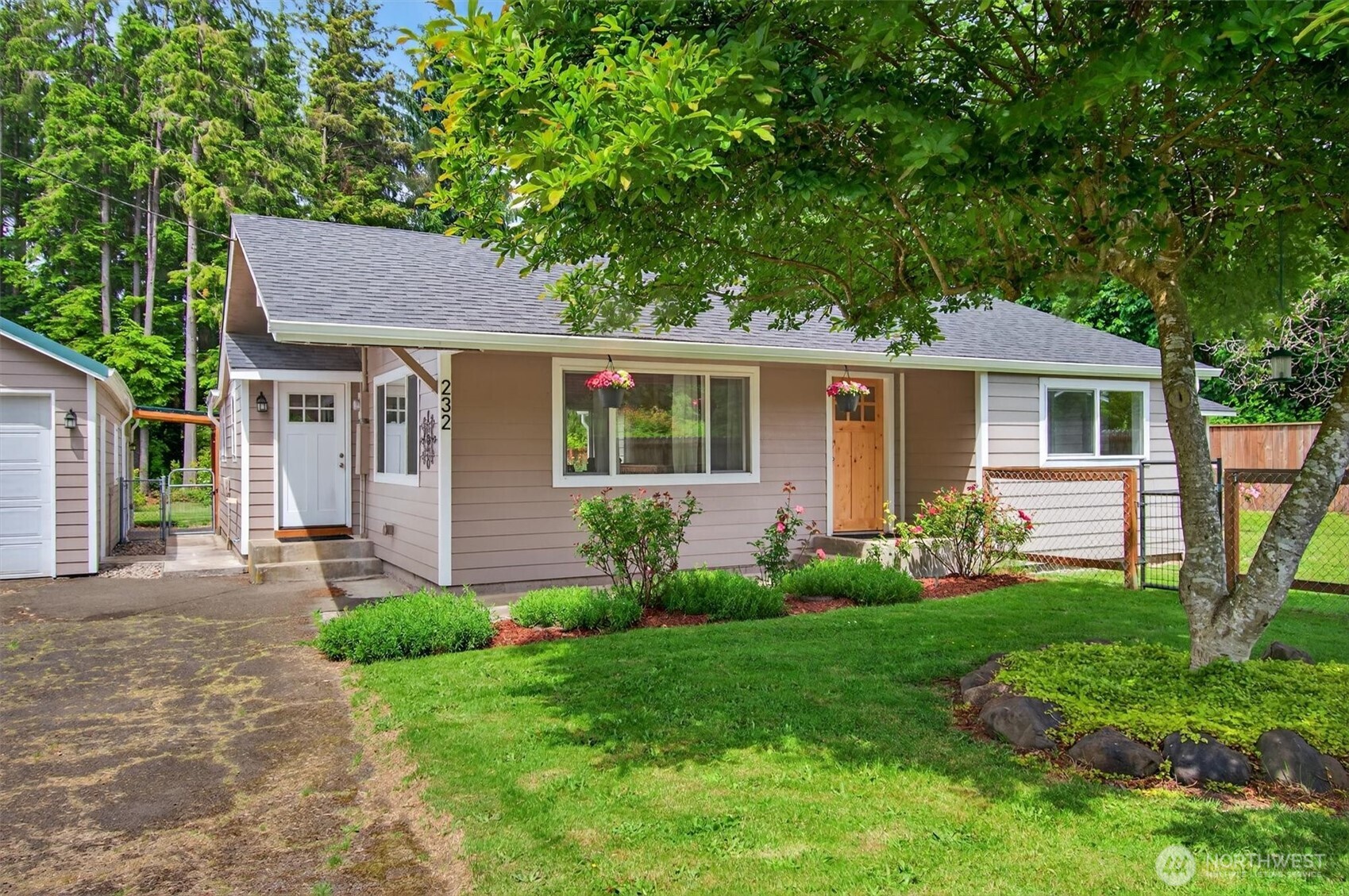Gardener’s paradise! Completely redone in 2018/19, this charming 3-bedroom home glows with new life. Vaulted ceilings, quartz counter tops and acacia hardwood floors give the feel of home. Step out the back door to the fenced yard with dual dog runs, a vibrant garden (blueberries, strawberries, plums, apples and more), and newly built shed. Tinker in the 14'x8' barn/workshop with a sturdy cement floor, perfect for hobbies or storage, alongside a detached garage featuring a finished room with a cozy loft, ideal for a studio. The tall forest at the back of the yard makes a great play space. Time to take the next step to this turnkey beauty!