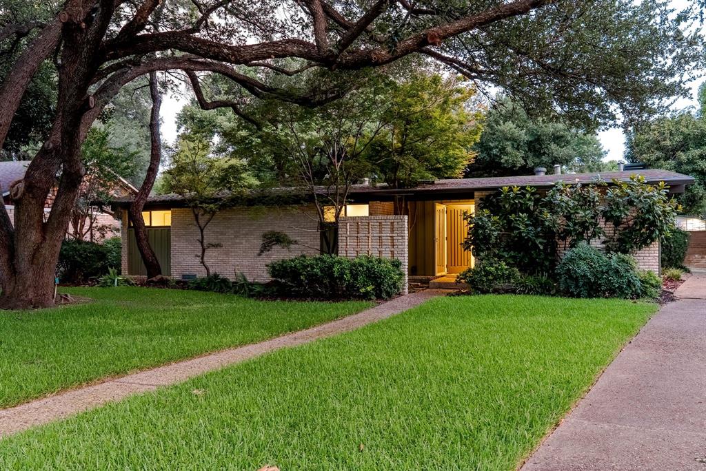 Rarely does a significant midcentury Ju-Nel home become available. Filled with warmths and character, this home showcases many original features, including parquet flooring and unpainted brick. With contributions of the second owner, Yung-Jen Tai, AIA, LEED AP, the home received an AIA award. Located in the coveted Eastwood Estates neighborhood near White Rock Lake, it features a signature courtyard overlooked by two of the three bedrooms and the living room. The kitchen has recently been updated with top-tier Bosch appliances and an expanded kitchen island. This mid-century modern home is as livable as it is iconic.