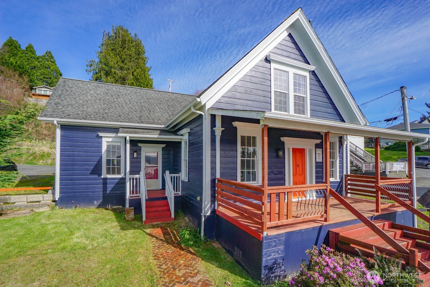 Nestled in the heart of Cathlamet, this 1870s historic gem perfectly blends small-town charm with modern functionality. Built with quality local materials, the home’s character shines through in its original fir floors, soaring ceilings, and elegant pocket doors. The main level is designed for effortless living, featuring 3 bedrooms, 1.75 baths, and a chef-ready kitchen complete with quartz countertops and solid wood cabinetry. Upstairs, a private lofted suite offers stunning river views, a full bath, and its own separate exterior entrance: perfect for a primary retreat or a guest suite.Enjoy sunset views of the Columbia River and the town from the expansive front porch, or take a short stroll to the local market, waterfront brewery, and marina. With dual-zoned commercial/residential status, separate entrances, and parking for 5+ vehicles, the possibilities are endless: a spacious home, a professional office, or a unique multi-generational setup. This home is currently rented. Owner/broker.