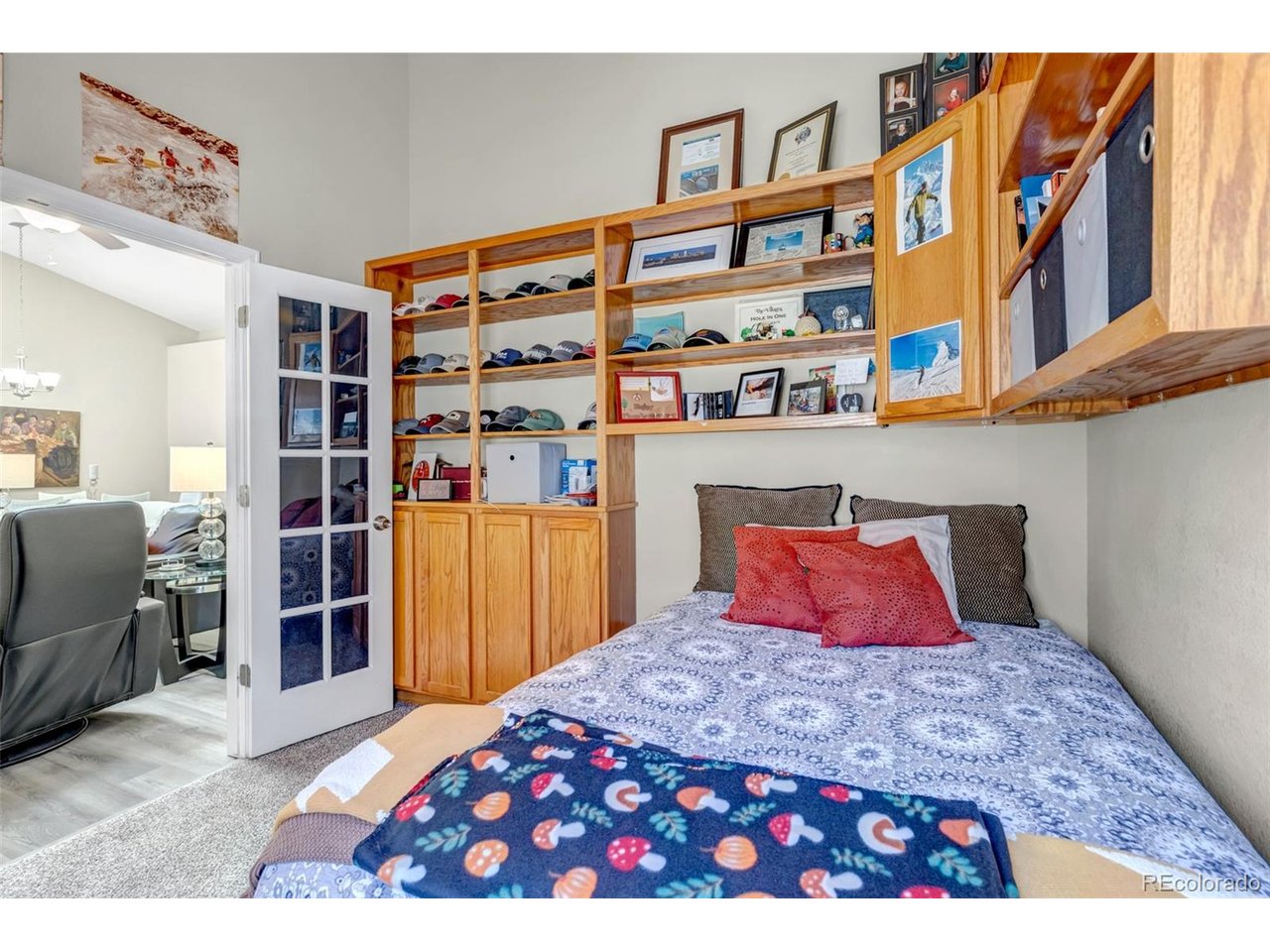 Enjoy secure, gated resort-style living at the Foothills Townhomes. Located in a highly desirable southwest neighborhood, this community offers convenient access to the Country Club of Colorado, shopping, hiking trails, and the Cheyenne Mountain Zoo. This beautifully maintained one-level townhome features 3 bedrooms, 2 bathrooms, and an attached two-car garage. The home offers tall ceilings, rounded corners, architectural niches, and a spacious open feel throughout. Attractive wood laminate flooring complements the main living areas, with cozy carpet in the bedrooms. The bright and spacious layout makes this home comfortable and inviting. Washer, dryer, and window coverings are included, making this home move-in ready. This well-cared-for property offers comfort, convenience, and low-maintenance living in a desirable gated community