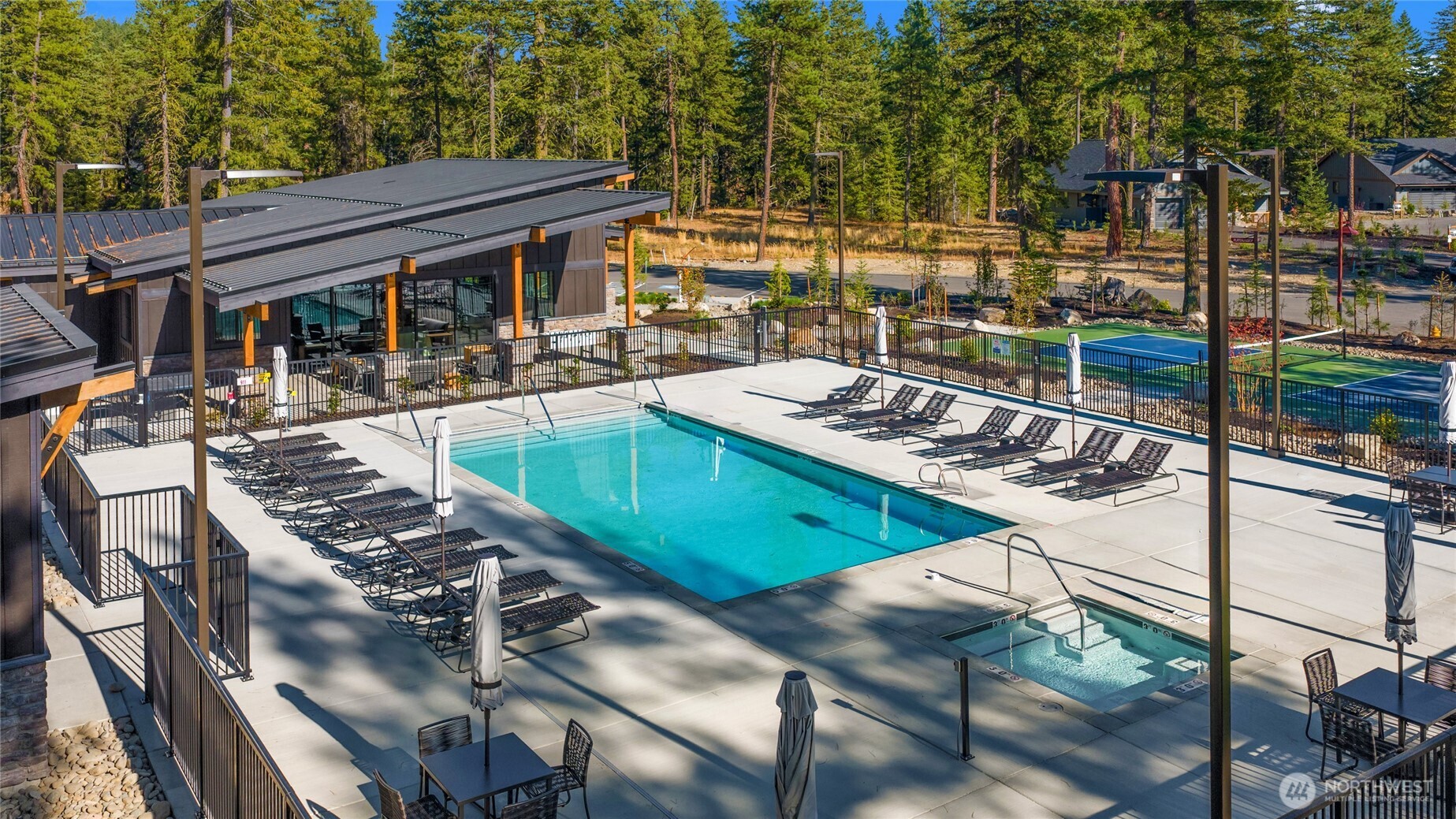 The Uplands Clubhouse with pool, hot tub, and pickleball court.