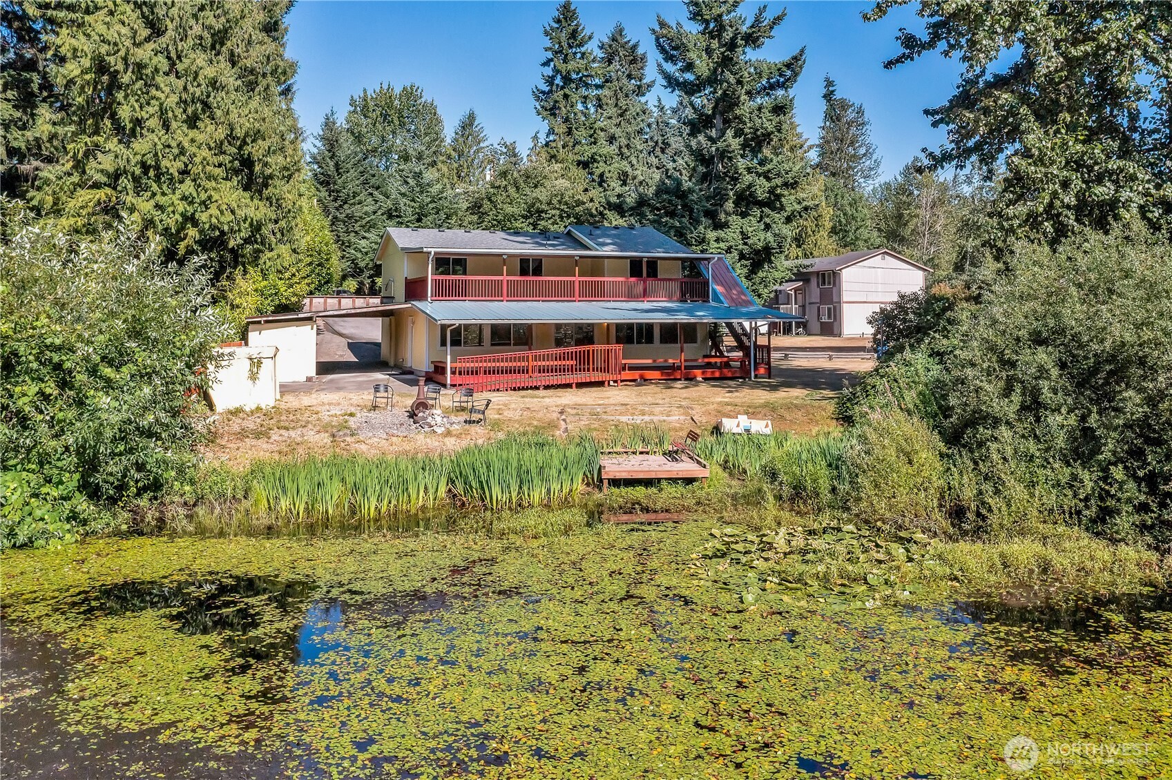 **NEW FLOORING THROUGHOUT & NEW FULL BATHROOM ENSUITE** This 5bdrm 2.75bath home is nestled on a private & secluded cul-de-sac. Come sit on the oversized multilevel covered deck & sip your morning coffee while watching wildlife. This home backs to 75ft of waterfront & is one of the best lots on the lake to enjoy: paddle boarding, kayaking & fishing off the dock. Main level offers 2 bdrms & 1 full bath, kitchen, din & living room. Lower level features separate living space w/2nd kitchen, family room, 3 additional bedrooms & upgraded bath w/tile floors & shower & NEW FULL BATH. Separate entry w/ramp perfect set up for adult family home, multigenerational living, small business/day care etc. Newer hot water heater, roof & septic system. Great location & easy access to hwy 410. Close to bus lines, dr offices, dining & shopping. Award winning Sumner-Bonney Lake School District.