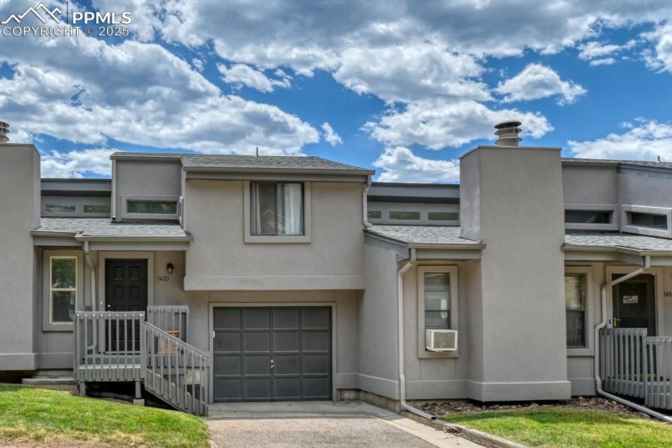 Enjoy breathtaking views in this beautifully maintained 2 bedrooms, 2 bath townhouse. From almost every window you will see Colorado's mountains and fantastic rock formations.  This well-appointed unit features luxury vinyl plank flooring throughout the main and upper levels, vaulted ceilings and a neutral color palette that complement any style. Large and open living room features a vaulted ceiling, decorator niches, wall-mounted TV and electric fireplace   This home offers more than some with a spacious family room located in the finished walk-out basement.  This space is ideal for large furniture for moving nights, home office, gym space, or another area visiting friends and family.  Enjoy the convenience of an attached one-car garage.  Quick access to Ute Valley Park’s hiking and biking trails. Just minutes from shopping, dining, I-25, and all the outdoor recreation Colorado has to offer.