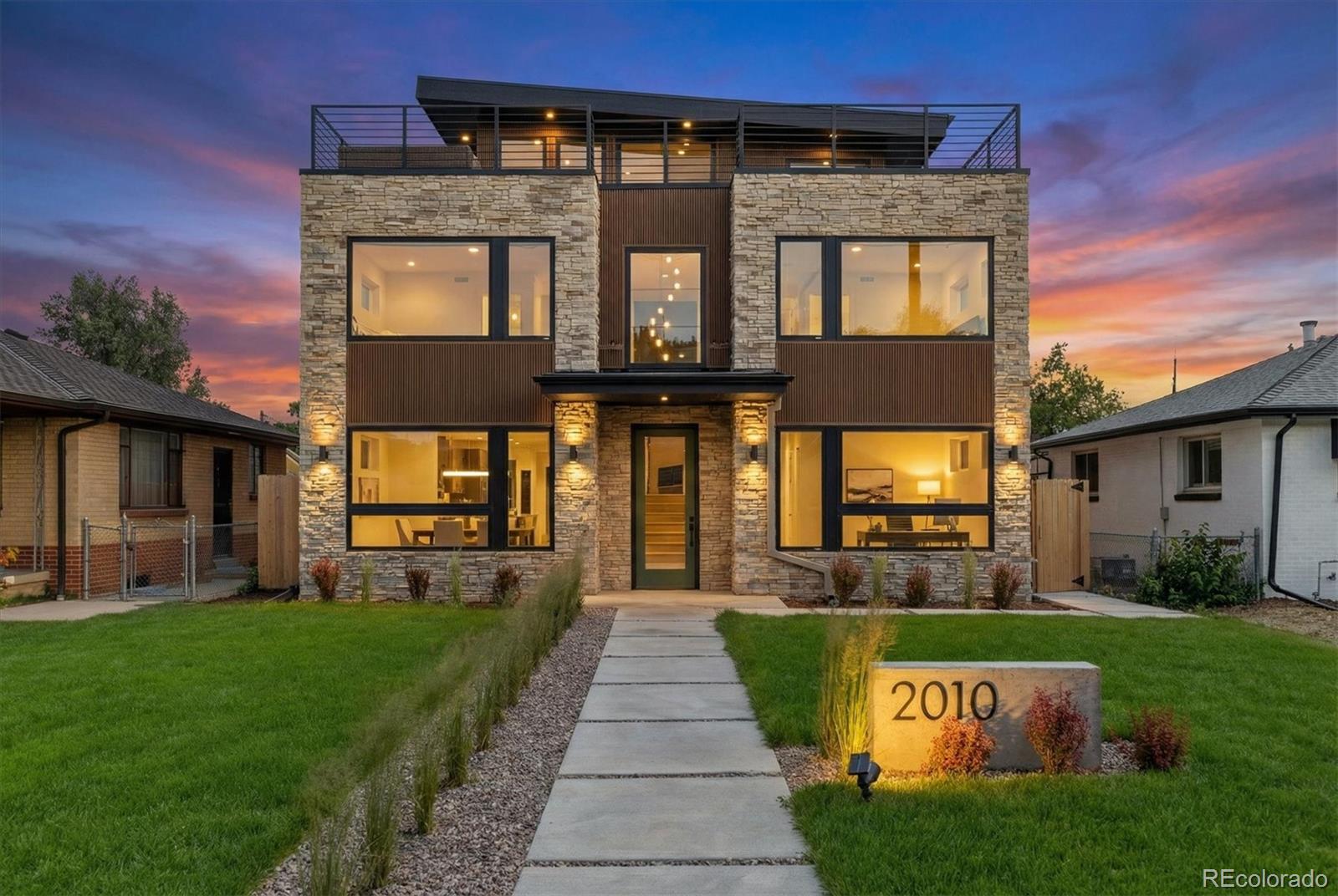 **Experience modern luxury at its finest—right on the edge of Sloan’s Lake.** This newly built three-story residence delivers over 4,100 sq ft of high-end design, effortless livability, and unbeatable access to Denver’s most vibrant outdoor lifestyle. Perfectly positioned across from Hallack Park, the home offers rare park frontage, walkability, and the kind of indoor-outdoor flow buyers rush to secure in this neighborhood.Four spacious bedrooms—each with its own ensuite bath and custom walk-in closet—provide exceptional privacy and flexibility for families, guests, or work-from-home living. The gourmet chef’s kitchen features sleek quartz countertops, premium appliances, a large island, and a sunny breakfast nook, all opening to expansive living and dining spaces ideal for entertaining. Floor-to-ceiling windows and soaring ceilings flood the home with natural light, creating a warm, elevated atmosphere throughout.The primary suite is a true retreat, complete with a private fireplace, spa-inspired five-piece bath, dual custom closets, and peaceful park views. The third level adds even more versatility with a spacious great room, additional bedroom and bath, and access to the show-stopping rooftop deck—perfect for sunset cocktails, mountain views, and unforgettable gatherings.A large private yard, oversized three-car garage with EV charging, and U-TU-C zoning with ADU potential offer both immediate comfort and long-term value. With new construction, walkability, park frontage, and proximity to Sloan’s Lake, dining, and entertainment, this home delivers a lifestyle that rarely becomes available—and never lasts long.**Opportunities like this move fast.** If you’re seeking luxury, location, and long-term upside in one of Denver’s most coveted neighborhoods, this residence is ready now.
