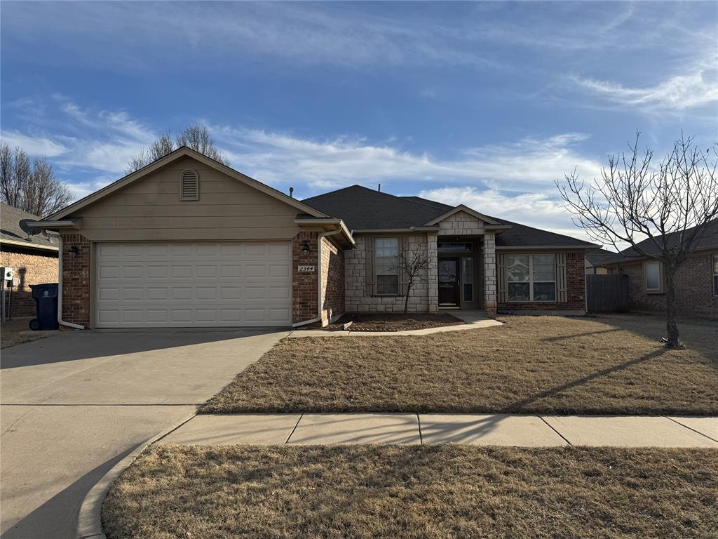 Experience the perfect blend of style and function in this bright, open-concept home featuring rich wood flooring and a split floor plan for maximum privacy. The chef’s kitchen shines with granite countertops, a large island/breakfast bar, and a walk-in pantry. Relax in the expansive living room by the fireplace or work from the private study, both featuring elegant custom built-in shelving.The primary retreat offers a spa-like ensuite with a double vanity, soaking tub, separate shower, and a massive walk-in closet. Massive windows flood the home with natural light throughout. Perfectly located steps away from the community library, park, and premier shopping. Includes a 2-car garage. Ready for immediate move-in!