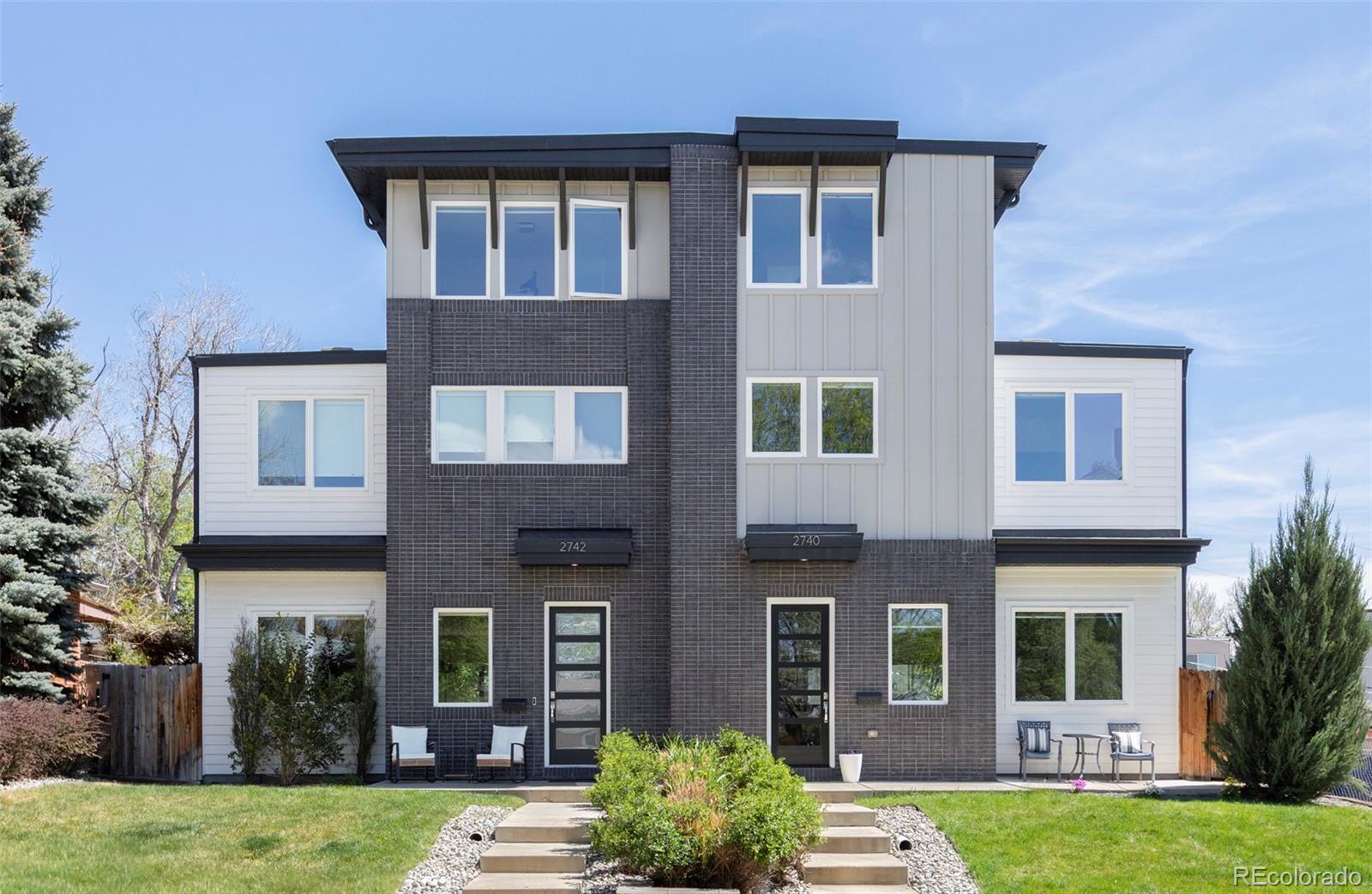 Located in one of Denver's most popular neighborhoods, this stunning urban contemporary home seamlessly blends modern design with exceptional functionality, offering four spacious bedrooms and five beautifully appointed bathrooms. The thoughtfully designed main level is ideal for both entertaining and everyday living, featuring inviting living and family rooms—each with its own fireplace—flowing effortlessly to a private backyard patio, perfect for indoor-outdoor living.  The open-concept layout creates a welcoming atmosphere, highlighted by a generous dining area and a convenient breakfast bar that anchors the heart of the home.  Upstairs, the luxurious primary suite serves as a true retreat, complete with dual walk-in closets and a spa-inspired five-piece bath.  Secondary bedroom with adjoining bathroom for kids or guests.  The third-floor loft adds incredible versatility, featuring a sleek wet bar and access to a rooftop deck—an ideal setting to unwind in the brand-new hot tub while taking in sweeping city and mountain views.  The finished basement further expands the home’s livability with a spacious family room, an additional wet bar, a bedroom, and a bathroom—perfect for guests or multi-generational living. Just a short distance to Sloan's Lake and very close to many shops & restaurants.  Some of Denver's finest dining options are just a few blocks away. Offering a refined blend of sophistication, comfort, and elevated urban style, this home delivers an exceptional living experience!