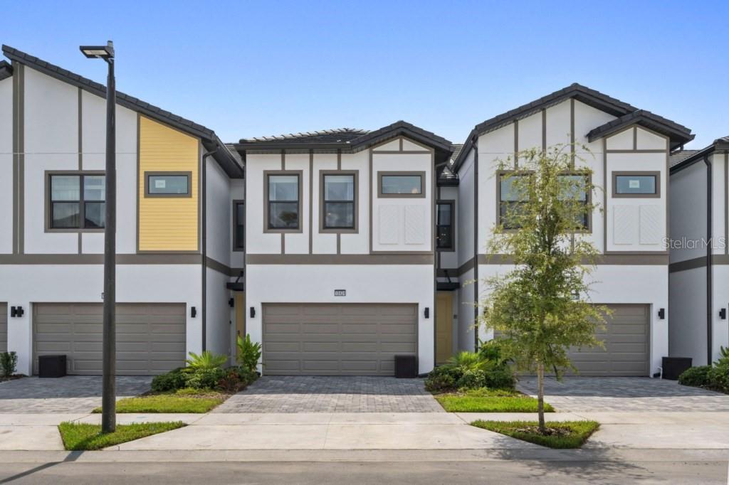 Step into a standout opportunity in the heart of Orlando’s premier vacation corridor. This beautifully designed 5-bedroom, 5-bath Latitude Townhome by Park Square Homes delivers the perfect blend of comfort, style, and investment potential, just minutes from Disney, Universal, SeaWorld, world-class shopping, and top-tier dining.Offered fully furnished and professionally decorated, this home is truly move-in or rental-ready. The current owner has invested significantly in high-end décor and thoughtfully curated finishes, creating a refined and memorable space that immediately appeals to guests and buyers alike.Inside, you’ll find a spacious open-concept layout enhanced by modern design elements and elegant details throughout. The home features a dual-zone climate system, allowing independent temperature control on each level for maximum comfort.Step outside to your private covered pool and spa—complete with heating, jets, and ambient lighting—perfect for relaxing or entertaining year-round.The 2-car garage offers incredible versatility and can easily be transformed into a game room, media lounge, fitness space, or kept as secure owner storage.Located within a gated, guard-controlled community, residents and guests enjoy access to the exclusive Aquarius Clubhouse, featuring resort-style amenities including a pool, lazy river, fitness center, café, and game room.This is more than just a home!! it’s a fully curated experience and a prime investment opportunity in one of Orlando’s most desirable locations. Schedule your private showing today.