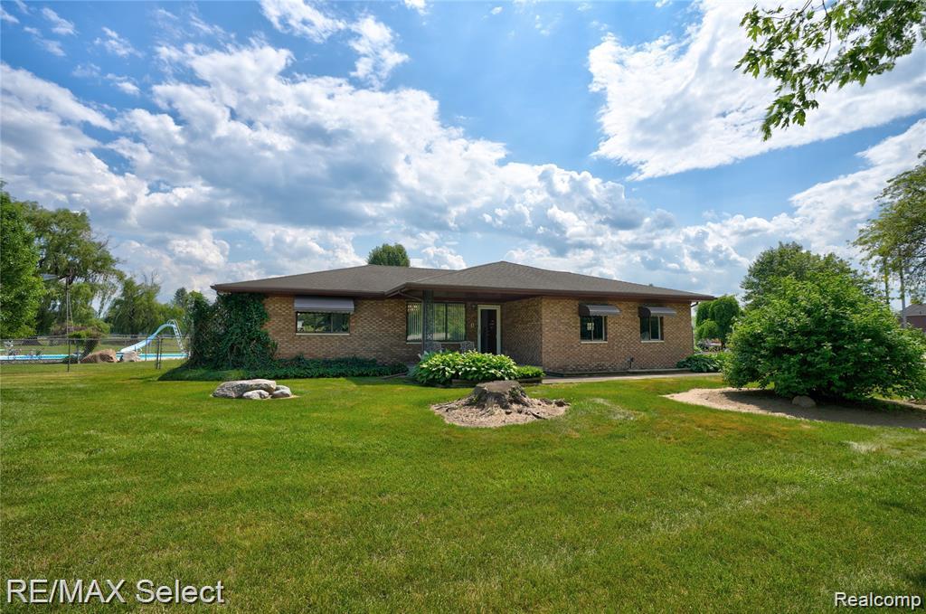 Welcome to your own private retreat! This 3 bedroom, 2 bath brick ranch is nestled on more than 27.6 scenic acres featuring two serene ponds, a fenced in-ground pool with pool house, multiple pole barns and outbuildings, and a spacious covered deck—perfect for relaxing or entertaining. Inside, you'll find an inviting eat-in kitchen with oak cabinetry and ceramic tile floors, a cozy firelit family room, and a convenient laundry room with ample storage and stainless steel washer and dryer. The primary bedroom offers warm wood flooring and a private bath. The lower level is ready for your finishing touches to add additional living space or recreation areas. Updated with fresh paint and stylish new flooring throughout in 2020. Don't miss the opportunity to own this one-of-a-kind property with endless possibilities for hobby farming, recreation, or simply enjoying peaceful country living!