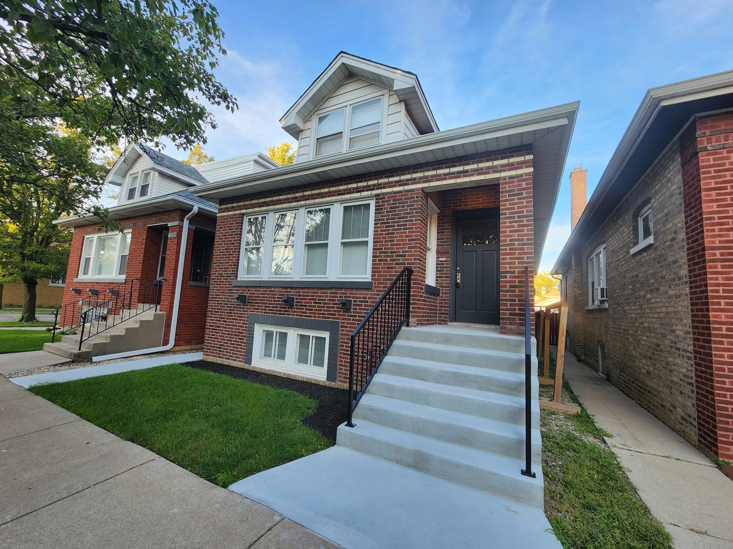 Great opportunity to own in Portage Park! Welcome to this beautifully updated 5-bedroom brick bungalow with dormers in the heart of Portage Park. Featuring 3 levels of living, high ceilings, hardwood floors, and timeless charm throughout, this home blends classic character with modern updates.  The renovated kitchen offers modern cabinetry, a spacious island with seating, and an additional dining area-perfect for gatherings. Just off the kitchen, enjoy the enclosed porch leading to your private backyard and a new large 2 car garage. Upstairs, the primary suite boasts a large walk-in closet and full bath. The second level also includes two additional bedrooms, a half bath, and a sun-filled loft area ideal for an office or reading nook. The finished basement provides even more living space with a bedroom, half bath, a generous laundry room, and plenty of storage.  Additional highlights include two brand-new HVAC systems for year-round comfort and efficiency. Move-in ready-schedule your showing today! List agent has interest in the property.
