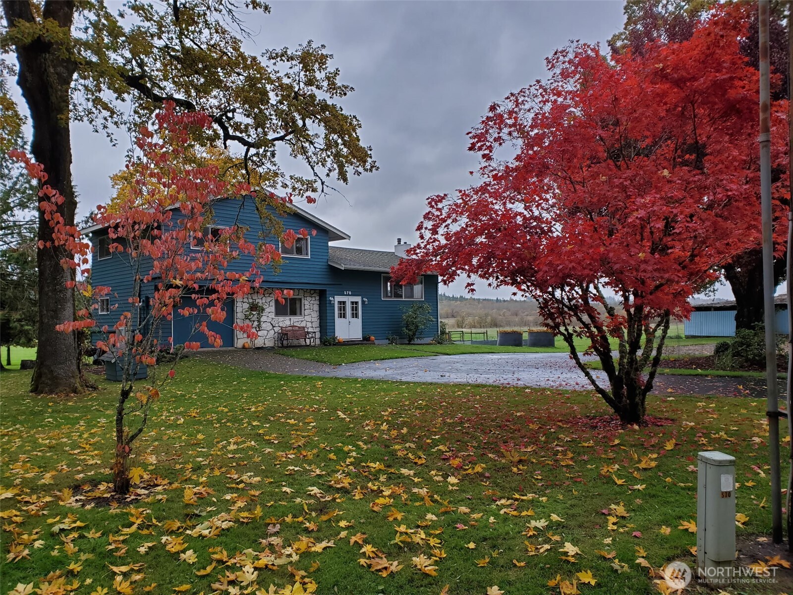 A Rare Country Estate – A Must-See Property!  Discover the perfect blend of comfort, functionality, and wide-open space with this beautifully updated and meticulously maintained 2,760 sq ft home nestled on 48.5 acres of prime, land. This 3-bedroom, 2-bath residence offers room to breathe—inside and out—while showcasing thoughtful upgrades throughout.  Step inside to find stunning custom tile work in the bathroom, generous living spaces, and a centrally located home office ideal for remote work or creative pursuits. The spacious kitchen features abundant cabinetry and expansive counter space, perfect for gatherings and everyday living. Cozy up to the fireplace in the main living room or enjoy the wood-burning stove in the daylight basement. Large closets and ample storage ensure everything has its place.  Take in breathtaking panoramic views from the main-level deck, or relax in the shade of the patio—wired and ready for a hot tub—making it an ideal retreat for summer evenings. The beautifully landscaped grounds include large trees, blooming flowers, and lush lawn areas, along with a new storage shed for added convenience.  Equestrian enthusiasts will appreciate the incredible 12,231 sqft barn, offering endless possibilities for horses, livestock, equipment, or hobby farming. With expansive acreage and exceptional infrastructure already in place, perfectly suited for those seeking a premier equestrian estate or private country haven.  This is more than a home—it’s a lifestyle.