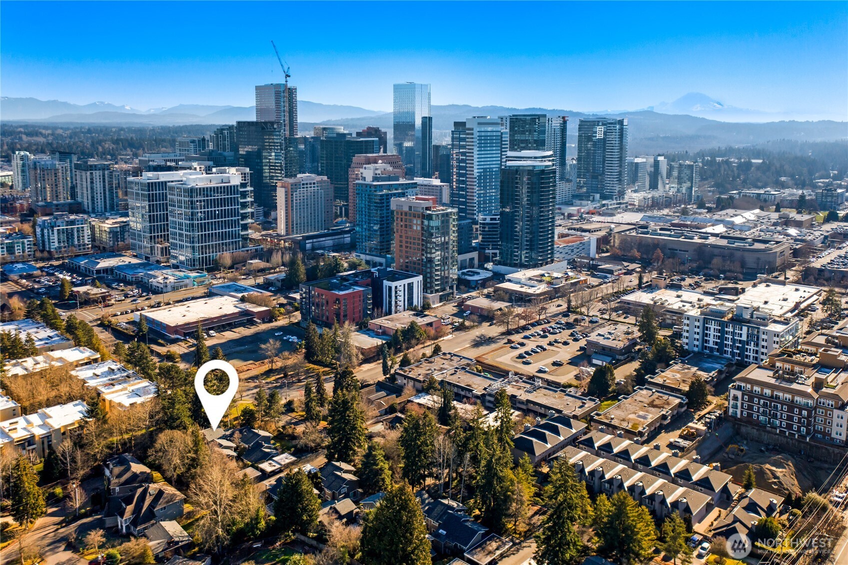 Seller is ready to work with your offer! No yard work, no compromises, all of downtown Bellevue at your feet. This fully remodeled 2bd/2.5ba in Regents Park, lives like a single-family home, minus the maintenance. Priced at $800K for easy, lock-and-leave urban living.  Inside: bamboo floors, a wood-burning fireplace, and a spacious deck perfect for morning coffee or evening wine. The main floor flows effortlessly from kitchen to dining, with powder room and laundry for easy single-level living. Upstairs, a private primary suite with walk-in closet and en-suite bath, plus a second bedroom and full bath ideal for guests, roommates, or a home office.  Tucked into a quiet, tree-lined setting, yet walkable to top-rated Bellevue schools, parks, shopping, dining, the waterfront, and transit. Reasonable HOA & it covers most of the utilities. Perfect for busy professionals, downsizers, or anyone craving urban convenience without condo compromises.