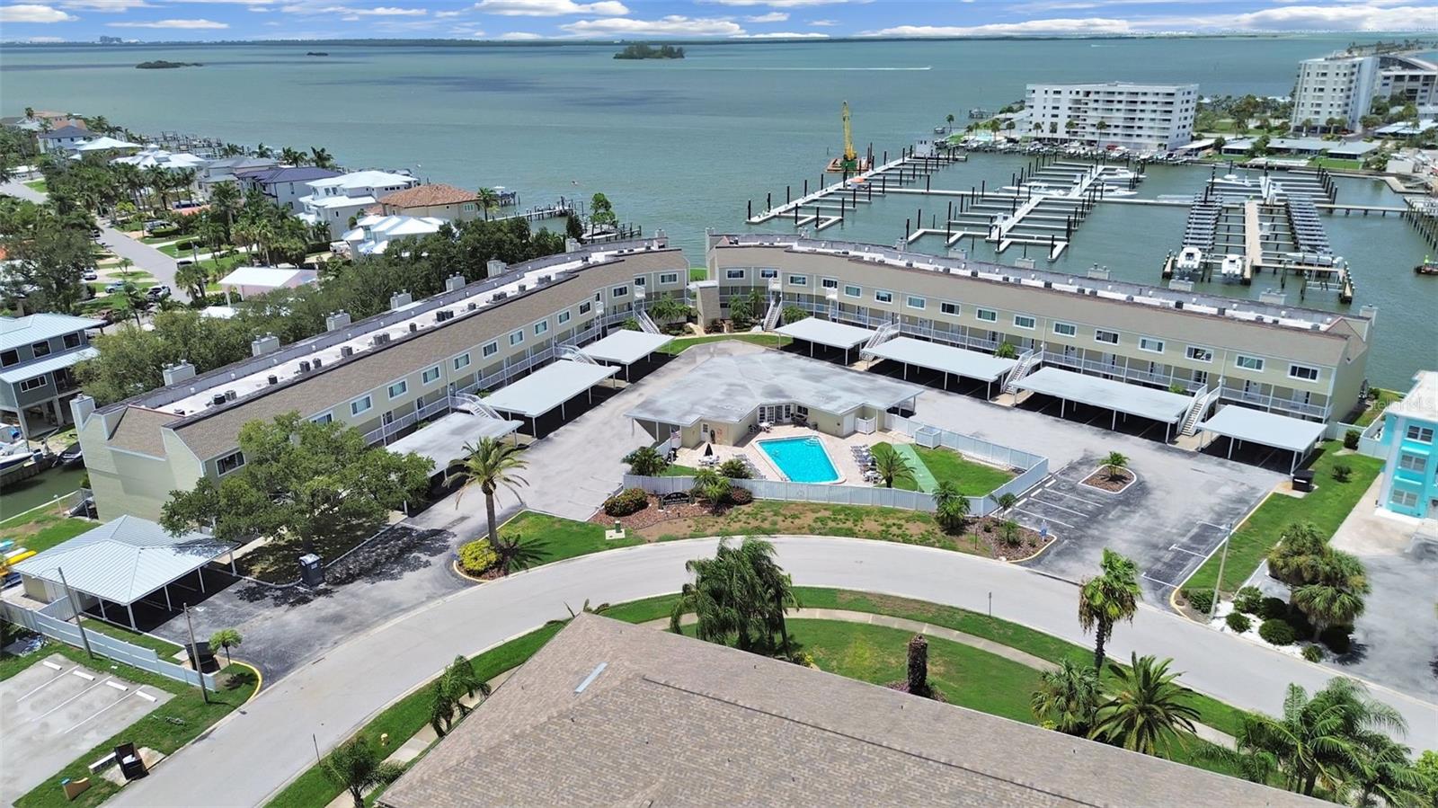 Welcome to your new light-filled waterfront retreat on the breathtaking Dunedin Causeway! This beautifully updated condo offers the perfect blend of coastal elegance and effortless Florida living. Featuring luxury vinyl plank flooring, stunning granite countertops, crisp white Shaker-style cabinetry with soft-close doors and drawers, and gleaming stainless steel appliances, this home is both stylish and functional.The open-concept kitchen and living area create a warm and inviting space perfect for everyday living and entertaining. The oversized kitchen island provides ample workspace and serves as the perfect gathering spot. The living room opens to your balcony overlooking an intracoastal canal, where dolphins, manatees, sea turtles, and otters are often seen enjoying the tranquil waters. Electric panel and cast irons pipes have been updated/replacedStep onto the sun-dappled balcony, breathe in the fresh salt air, and take in breathtaking panoramic sunsets over the water. A perfect place to relax and enjoy the beauty of Florida's endless horizons.Upstairs, you'll find two spacious bedrooms, each featuring its own ensuite bathroom for privacy and convenience. Both bedrooms offer generous wall-to-wall closets and beautiful picture windows that bring in natural light. The windows and sliding glass doors were upgraded to hurricane-grade in 2018, providing added peace of mind.Enjoy resort-style amenities with a sparkling saltwater pool, perfect for unwinding after a day at the beach. The clubhouse is currently undergoing renovations, adding to the community's future appeal.Located on the iconic Dunedin Causeway, this home places you just minutes from the crown jewel of the area, award winning Honeymoon Island State Park! Enjoy pristine white sand beaches, nature trails, picnic pavilions, playgrounds, and even a dog-friendly beach. Experience the best of waterfront living, outdoor adventure, and the laid-back coastal lifestyle Dunedin is famous for.