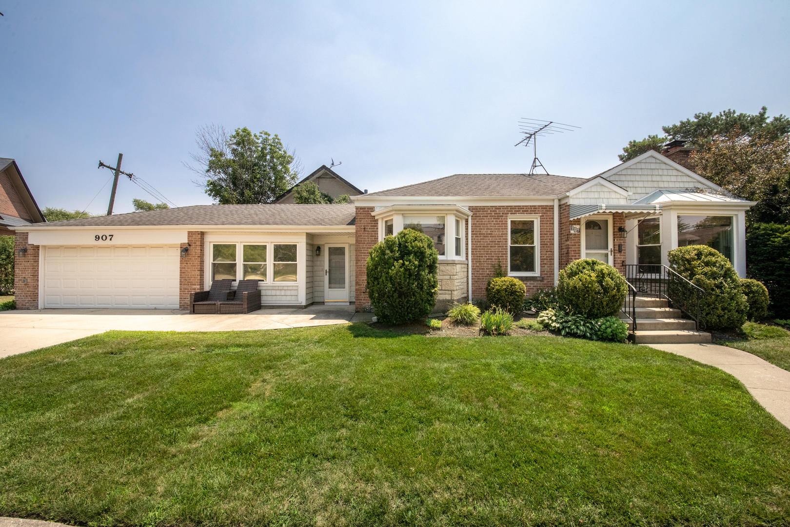 SHOWINGS BEGIN AUGUST 4.  This well-maintained and freshly painted ranch-style home is truly move-in ready. Located on tree-lined Wilkinson Parkway, 907 is a three-bedroom, two-bathroom residence nestled on a sunny corner lot that provides natural light throughout the day.  The main level features three bedrooms, a full bathroom, a cozy family room with a fireplace, a separate dining room, and an eat-in kitchen. An additional larger dining area is located just off the kitchen, perfect for entertaining or everyday meals.  The fully finished basement includes a gas fireplace, a full bathroom, a large cedar closet, a laundry room, a large rec room, and generous storage throughout. The two car attached garage provides convenience and functionality for those Illinois winters!   Located just minutes near different schools, shopping areas, parks, the a Metra station and O'Hare airport, this house on Wilkinson Parkway is an ideal location in the city of Park Ridge. Bring your backyard ideas, there's plenty of room to make them a reality!