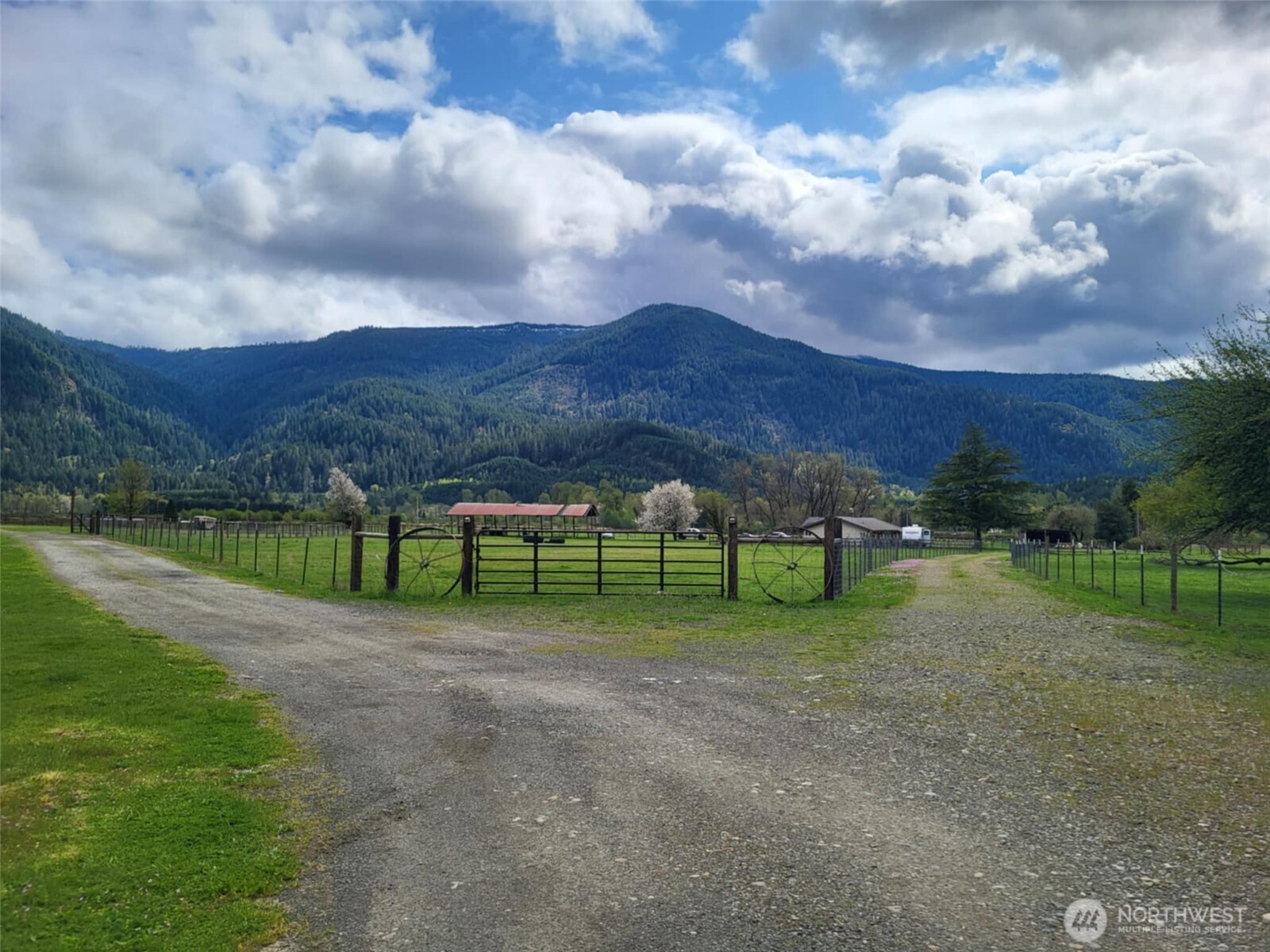 One of a kind opportunity to own 40 Acres to include a 2,296 sqft ranch home, 2 Barns (approx 8,000 sqft & approx 5,000 sqft) with both a shop area and tack room great for hobby farm or business opportunities to run cattle or board horses, 2 Silos, Calving Barn and feeding area,  6 horse stalls with run outs, chicken houses, 3 RV Hook ups with water and power with additional well drilled. The ability to run cattle, or have a horse boarding facility is an option. Private access to Davis Creek AND SO MUCH MORE. You are a short 30 min drive to White Pass Ski area, close to Cowlitz River and will enjoy the 360 views of the Cascade Foot Hills and the herds of elk that roam the area. Option to purchase even more parcels available.