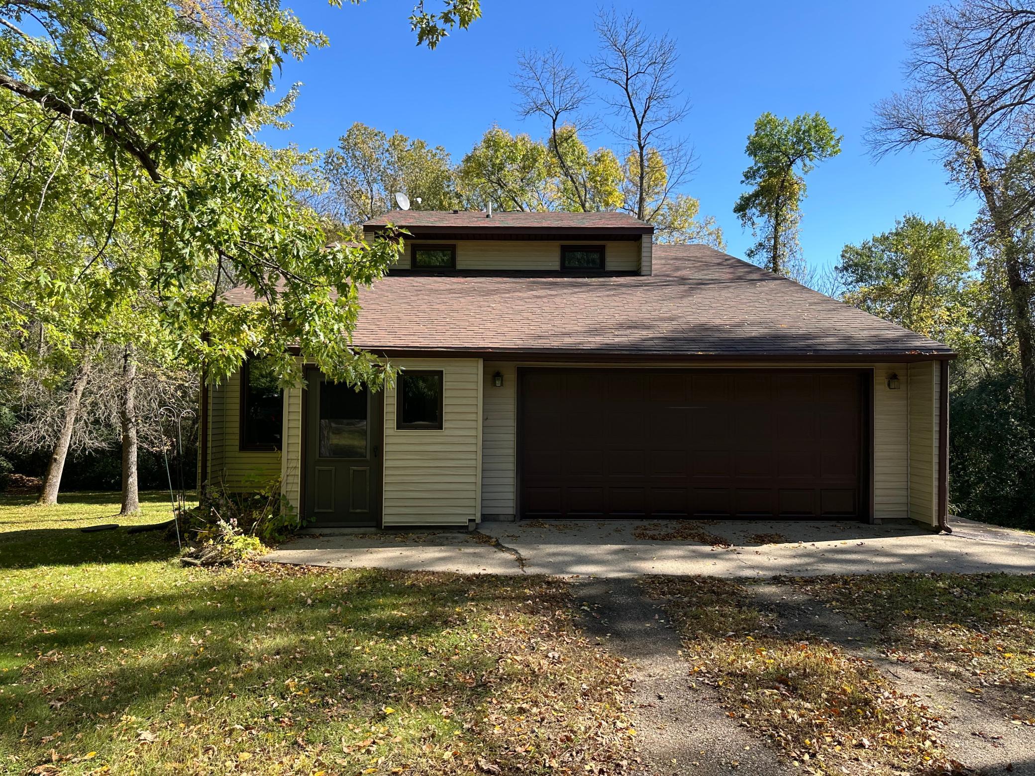 1-Owner 3-bedroom country home on 2.8 acres, just minutes from Paynesville on a paved road. Built in 1979 and offering 2,630 finished square feet, this home has room for everyone. The main level features a kitchen, a dining room with a patio door leading to a 10x14 deck, a living room, an office/den, and a half bath. Upstairs you'll find three nicely sized bedrooms, a full bath, and a finished storage room. The walkout lower level adds a family room and a laundry/half bath. A 2-car attached garage completes the home. Enjoy space to spread out with a convenient location.