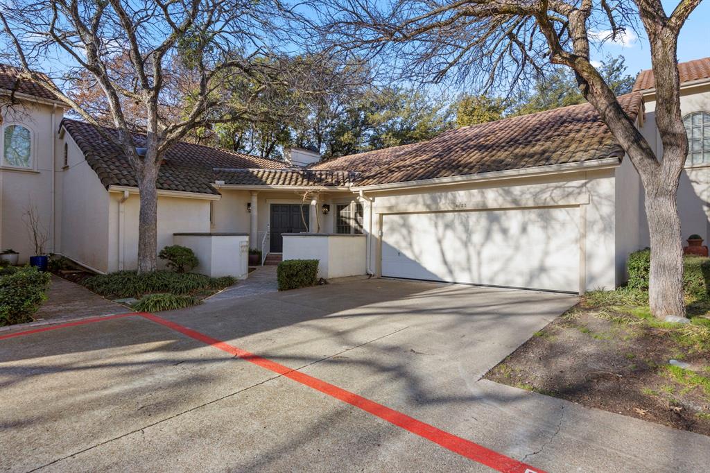 Discover effortless lock-and-leave living in this spacious one-story condo in the heart of Las Colinas, in the secure gated community of Country Club Place.  Enjoy a cozy fireplace and floor-to-ceiling windows in the living room, overlooking the picturesque wraparound backyard and patio.  Natural light fills the home, and an adjacent dining room is ideal for entertaining.The kitchen features granite countertops, an island, and new KitchenAid appliances, including a cooktop, oven-microwave combo, and warming drawer.  It is complemented by a built-in Sub-Zero and wine-beverage refrigerator, plus an eat-in breakfast room with bay windows.  A large utility room provides ample counters, sink, cabinets, and space for a full-size washer and dryer and an extra refrigerator or freezer.The spacious primary suite features a sitting area, double vanities, built-ins, garden tub, glass shower, and skylight, while the corner guest room includes built-ins with desk, walk-in closet, and private bath.  Recent upgrades include a high-efficiency heat pump HVAC system, fresh interior paint, new carpet, KitchenAid appliances, recessed lighting, dimmers, CAT6 wiring, new garage door opener, updated kitchen and utility faucets, new garbage disposal, and cellular-based security system.  Perfectly located just minutes from both major airports, shopping, dining, Toyota Music Factory, and more.