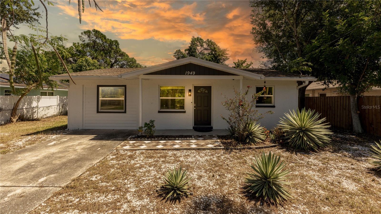 Welcome to 1949 Trotter Rd, a beautifully renovated 4-bedroom, 3-bathroom block home in the desirable Largo area. This move-in-ready residence offers a spacious open-concept layout with a split-bedroom floor plan and two en-suite bedrooms, providing comfort and flexibility for family and guests. The primary suite features a walk-in closet, while the updated kitchen showcases modern cabinetry and granite countertops. Property include a 2021 roof, 2023 HVAC, updated windows and sliding door, luxury vinyl plank flooring throughout, updated bathrooms, modern lighting and fans, and an indoor laundry area. Situated on a generous lot with a fenced yard, this home combines modern updates with convenient Florida living. Enjoy easy access to shopping, dining, recreation, major roads, and the beautiful Gulf Coast beaches.