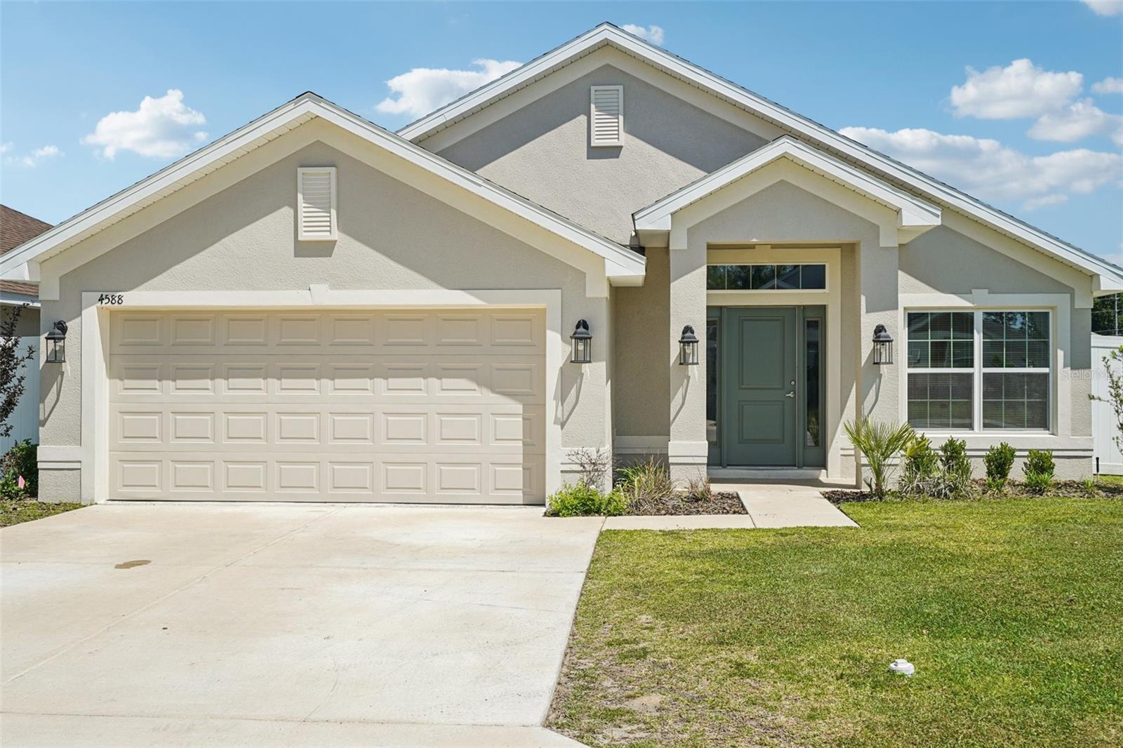 One or more photo(s) has been virtually staged. Welcome to this beautifully built 2024 home in Magnolia Villas West, offering 3 bedrooms, 2 bathrooms, and 1,490 square feet of thoughtfully designed living space. As you step inside, you’re greeted by a formal dining area filled with natural light, creating a warm and inviting first impression. Continue down the hall to the spacious kitchen, featuring stainless steel appliances, a center island with breakfast bar seating, and abundant counter and cabinet space—perfect for both everyday living and entertaining. Just off the kitchen, the living room provides a comfortable and connected space to relax and gather. The split-bedroom floor plan offers added privacy, with the primary suite tucked away as its own retreat. It includes an en suite bathroom with dual sinks, a walk-in shower, and a generous walk-in closet. Step outside to a fully fenced backyard with plenty of space to enjoy outdoor living, whether you’re hosting or simply unwinding. Additional highlights include a 2-car garage and a convenient location close to restaurants, grocery stores, and major highways, making it easy to enjoy everything Ocala has to offer. Don’t miss the opportunity to make this move-in ready home your own. Mortgage savings may be available for buyers of this listing.