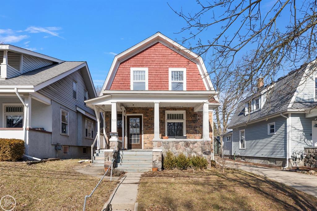 Charming 1914 Dutch Colonial Revival in the Heart of Ann Arbor. Step into a piece of Ann Arbor history with this beautiful early 20th-century Dutch Colonial Revival, showcasing the iconic gambrel roofline, red cedar shingle siding, and a welcoming full-width front porch framed by original stone masonry. Built in 1914, this character-rich home blends timeless architecture with an unbeatable location that is nearly impossible to replicate. Offering three bedrooms and two full baths across approximately 1,298 square feet of above-grade living space - plus a full basement - the flexible layout suits a primary residence or a great investment rental opportunity. The main floor features a generous living room, formal dining room, kitchen with pantry, a main-floor bedroom, and a full bath. Upstairs, a spacious primary suite and second bedroom each include walk-in closets. Location is where this property truly shines. Situated just five blocks from downtown Ann Arbor and four blocks from the vibrant Kerrytown District - home to Zingerman's Deli, the Ann Arbor Farmers Market, unique boutiques, and acclaimed dining - you are at the center of everything the city has to offer. West Park, Ann Arbor's beloved 27-acre greenspace, is just one block away. The Ride AAATA bus service stops right out front, and the recently completed Miller Avenue corridor improvements provide dedicated bike lanes and enhanced pedestrian infrastructure from your doorstep to downtown. Easy access to US-23 and I-94 makes commuting a breeze. Top-rated Ann Arbor Public Schools serve the property. Whether you're looking for a place to call home or a smart addition to your investment portfolio, 510 Miller Ave delivers on every front.