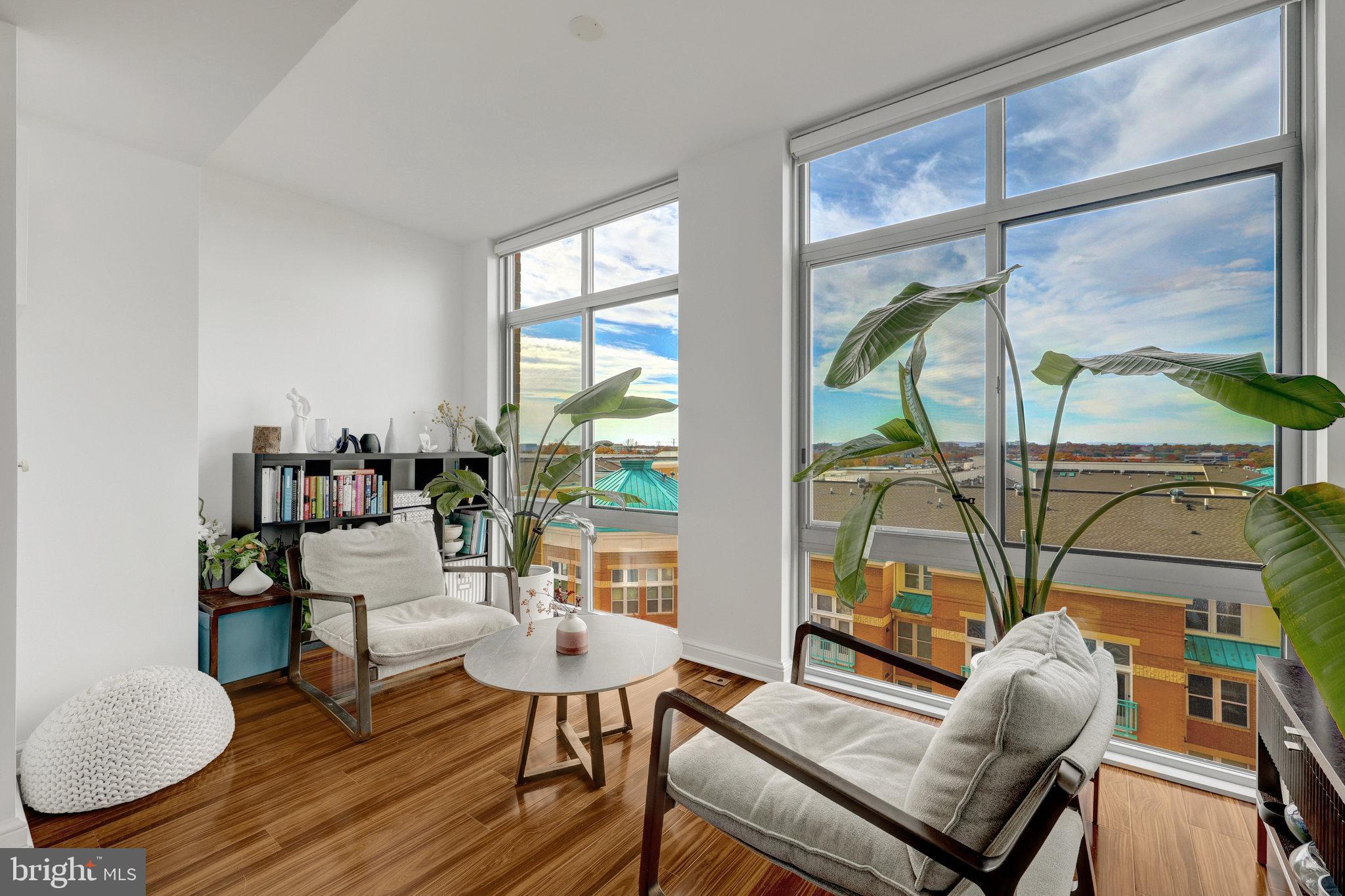 New Year. New Price. New Opportunity at Midtown at Reston Town Center!  Seller Welcomes All Offers.✨Price Improvement—now is the perfect time to make this stunning home yours!Welcome to your new beginning at Midtown at Reston Town Center. Be sure to watch the video tour—you’ll fall in love! Luxurious, modern, and beautifully appointed, this exceptional open-concept condominium delivers upscale living in one of Reston’s most desirable communities.From the moment you enter, you’ll experience a seamless blend of style and comfort. The remodeled kitchen is a true showstopper, featuring all-new custom cabinetry, expanded pantry space, and print-proof black stainless steel LG appliances—including a French-door refrigerator with craft ice, gas range with InstaView and Air Fry, whisper-quiet dishwasher, and smart microwave.This spacious residence offers two primary bedrooms and two full baths, each enhanced with custom-designed closets and modern sensor lighting. Start your mornings or unwind at sunset in the sunroom, where floor-to-ceiling windows, custom remote-control blinds, and sweeping western views create the perfect retreat.✨ Features You’ll Love:• Over $40K in 2024 upgrades• Wild Cherry flooring with enhanced soundproofing• Quartz countertops with matching backsplash• Cozy electric fireplace• Nest smart thermostat• Outlets with built-in USB & USB-C ports• Super-quiet food disposal• Full-size Bosch front-load washer & dryer (stacked)Every detail has been thoughtfully curated to support both elegant living and everyday convenience—making this price-improved offering an exceptional value in today’s market.Step into the New Year with the best of Reston Town Center living just outside your door: fine dining, boutique shopping, community events, outdoor concerts, festivals, the W&OD Trail, Reston Hospital one block away, and CVS just outside the Midtown entrance. Enjoy easy access to Dulles Airport (10 minutes), the Dulles Toll Road, Fairfax County Parkway, and the Silver Line Metro. Schedule your private showing today and take advantage of this exciting New Year opportunity—luxury living has never been more attainable!Seller Prefers RGS Title Reston.