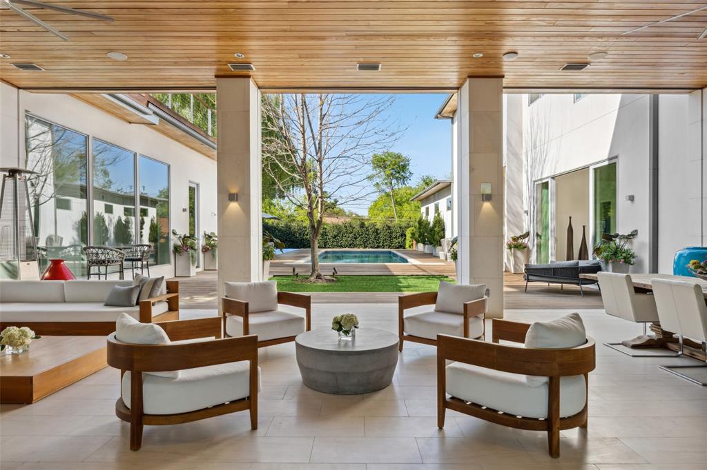 Stunning custom-built 9,783 sq. ft. estate on nearly an acre exemplifies luxury living with its exquisite design and amenities. The grand marble entryway welcomes you into a home of sophistication and comfort, featuring 12-foot ceilings and multiple living areas with a cozy gas fireplace. The first-floor opens to a year-round heated and cooled outdoor loggia with remote screens. A formal dining room with a fireplace sets the stage for unforgettable gatherings.

The gourmet kitchen delights culinary enthusiasts with top-of-the-line appliances, including a Sub-Zero fridge, Miele dishwashers, and a Gaggenau oven. The kitchen's center island and butler’s pantry offer ample space for entertaining.

Upstairs, the expansive primary suite is a luxurious retreat, complete with a gas fireplace, sitting area, coffee bar and two private verandas. The ensuite bathroom boasts dual vanities, a jetted tub, and an oversized shower with dual heads, complemented by two spacious walk-in closets.

The second floor features a versatile game room and four additional bedrooms with private baths. This property has a unique safe room with an exterior exit, a wine room, two laundry rooms, an exercise room, a formal study, and a dog wash area.

Outdoor amenities include a stunning pool, linear fire feature, and pickleball & sport court within a beautifully landscaped yard. The three-car climate-controlled garage offers epoxy flooring and loft storage.

Smart home technology throughout includes Control4 thermostats, a HEOS music system, and remote window treatments, ensuring every modern convenience is at your fingertips.