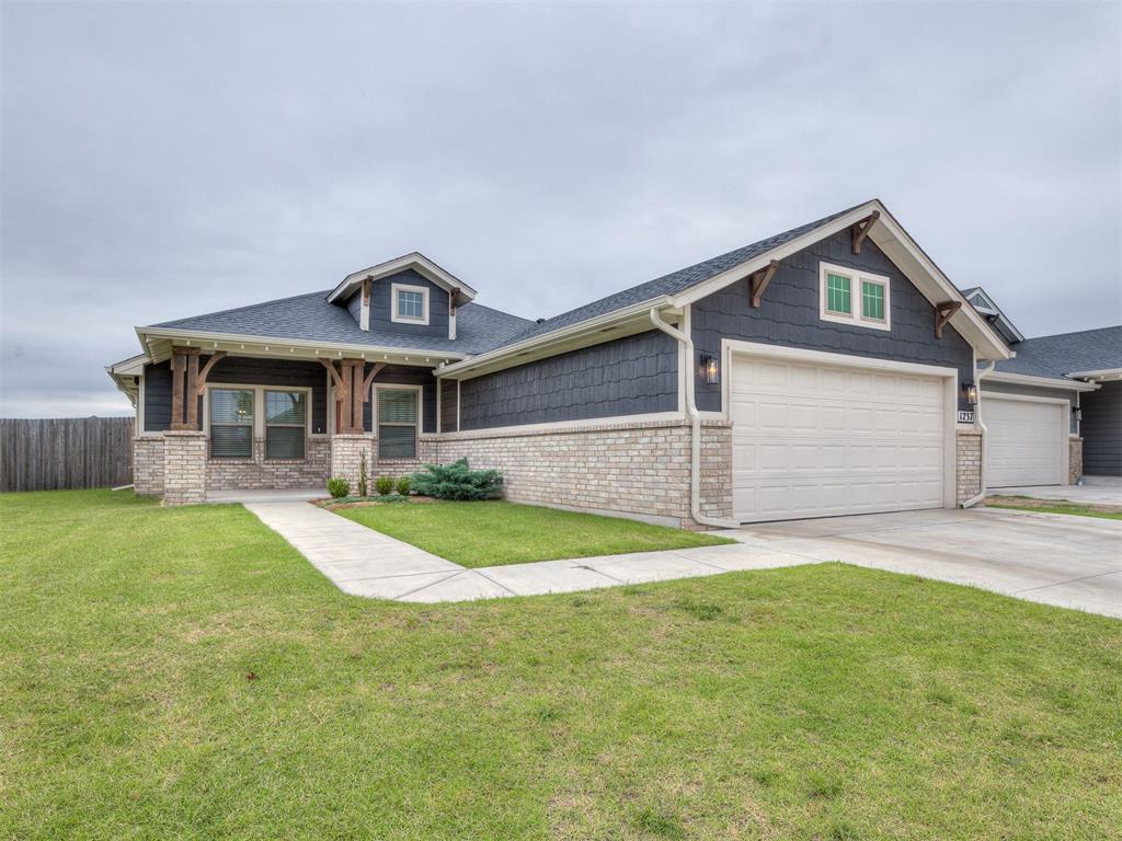 Beautiful, Craftsman style 3-bedroom home with a unique open floor plan that is spacious and great for entertaining! The kitchen comes with lovely quartz countertops and tile backsplash, gas range, and giant island that can serve as an eating space as needed! The primary bedroom suite offers double sinks, tub and walk-in shower and big walk-in closet! But wait, there's more....storage!!! Both secondary rooms come with linen closets in addition to standard closets! The laundry room is located conveniently next to the guest rooms with a drop zone/bench for coats, bags, and shoes for those on the go! The home backs up to a greenbelt with an access gate and covered back patio. Featherstone in located in Moore Schools with amenities such as a splashpad, playground, and walking trails! Owner licensed.
