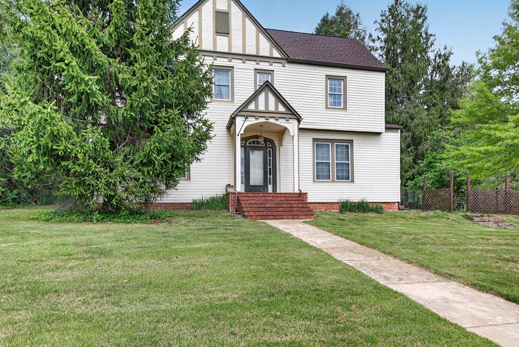 Seller is motivated! Make any offer, within reason, Seller will consider it. Step into timeless elegance with this stunning Tudor-style home, originally built in 1910. Rich in character and historic charm, this residence showcases classic architectural details and a warm, inviting atmosphere throughout. From its distinctive design to its enduring quality, this home offers a rare opportunity to own a piece of history while enjoying the comfort of a truly special property. Come in and add some of your touch to make it your home.