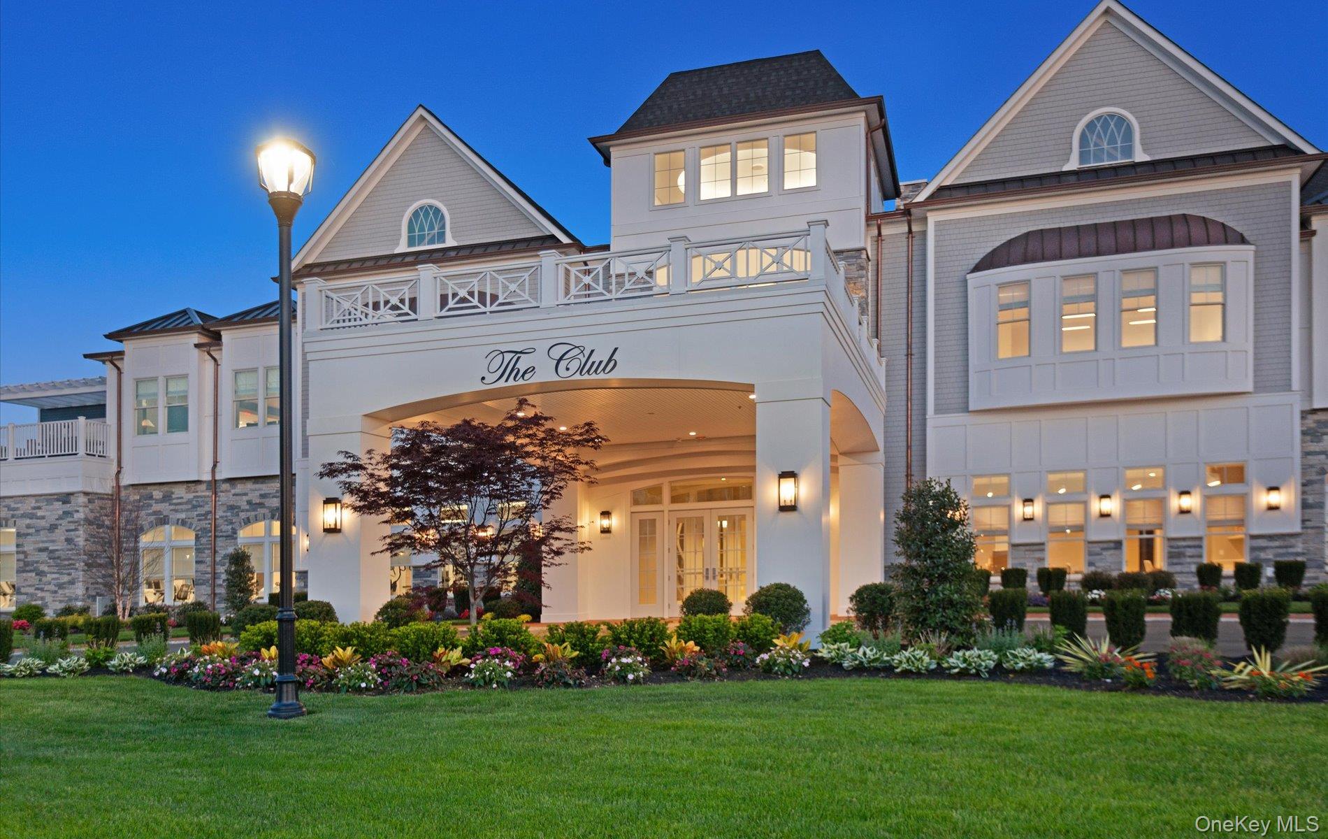 Discover refined, one-level living in this very sought-after Barclay model, a top-floor, corner end unit in the prestigious gated community of Country Pointe, Plainview. This sun-drenched 2-bedroom, 2-bath residence offers an open floor plan filled with natural light, beautiful neutral decor, hardwood floors, custom lighting, and soaring ceilings throughout.The chef’s kitchen is thoughtfully designed with gas cooking, stainless steel appliances, quartz countertops, designer upgrades and a center island—perfect for both everyday living and entertaining. The lavish primary suite is a true retreat, featuring two walk-in closets and a spacious spa-like private bathroom. A generous second ensuite bedroom serves perfectly as a guest room or home office and includes custom closet organizers.Enjoy seamless indoor-outdoor living with access to a maintenance-free private terrace, ideal for morning coffee or evening relaxation. Additional highlights include reserved lower-level indoor parking, private storage, easy elevator access and ample guest parking. Country Pointe delivers a resort-style lifestyle with 24/7 gated, manned security, concierge services, EV charging stations, and a full-time Director of Events. Amenities include a magnificent clubhouse with ballroom, theatre, library, dining areas, fitness center, exercise classes, two heated pools with poolside bar, tennis, pickleball, bocce courts, card and game rooms, sports and social bar and meticulously landscaped grounds. Minutes to world-class golf, Country Pointe Shops, dining, entertainment and transportation.This is more than a home—it’s luxury, convenience and lifestyle at its finest.