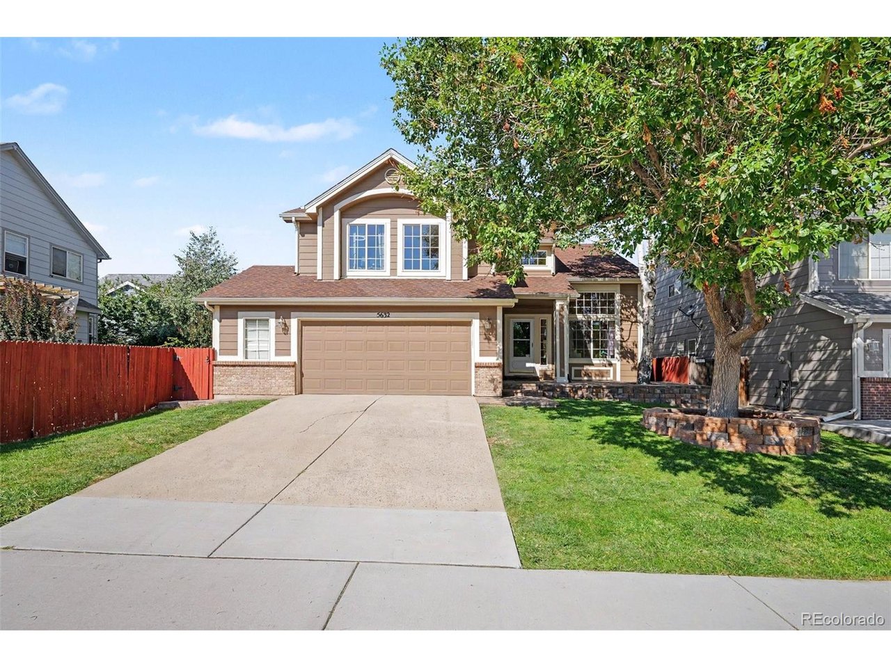 Fantastic 5-bed, 4-bath home spanning 2,700 square feet in Founder's Village! Enter a high-ceilinged foyer that opens directly into a main floor living room anchored by expansive windows and stairway. The open layout flows smoothly into the dining room, kitchen and family room with built ins and gas fireplace. Central kitchen offers stainless appliances, pantry, granite counters, modern cabinetry and flexible eat-in space. Sliding glass doors extend the space out to a private backyard featuring a spacious wooden deck with an overhead shade pergola, mature landscaping, and a fully fenced lawn with garden beds. The upper level includes four bedrooms, including a primary suite complete with vaulted ceilings, a walk-in closet, and well appointed primary bath. Downstairs, the finished basement serves as an autonomous secondary living space equipped with a full kitchenette, a dedicated family room, a private 5th bedroom, with private en-suite bathroom. Complete with an attached 2-car garage and low HOA/taxes. Easy walking distance of Rock Ridge Elementary, Mesa Middle School, neighborhood parks, open space trails, and community pool amenities. Call Listing Broker for private showing!