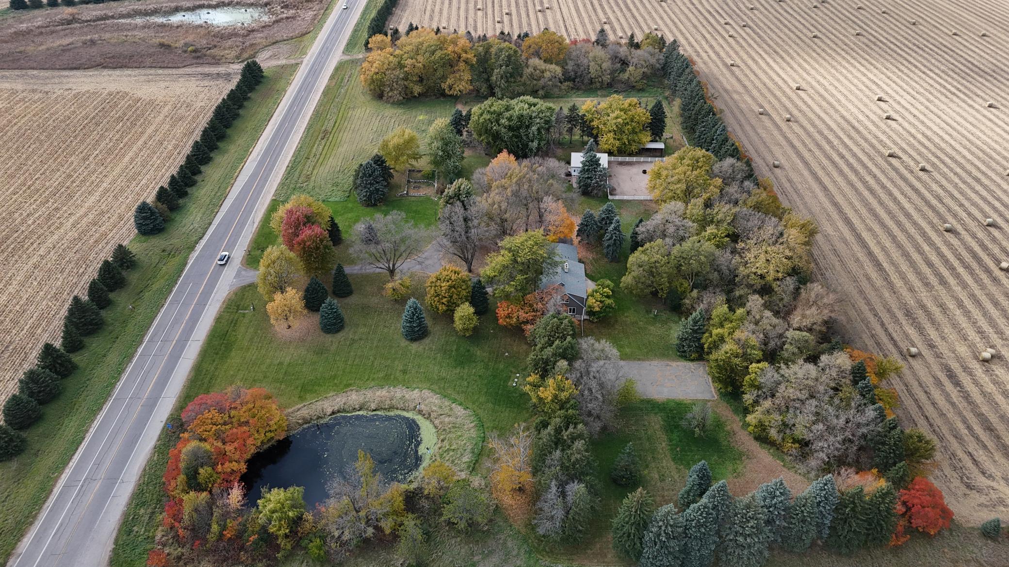 Experience country living at its best with this meticulously maintained 10.22-acre hobby farm, ideally located just off the blacktop with convenient access to both Willmar and Kandiyohi. Offering 3,169 finished square feet plus a full basement with additional finishing potential, this impressive home features 5 bedrooms and 5 bathrooms, including 3 en suite bedrooms—a rare and versatile layout with plenty of room for family and guests.The property has been thoughtfully cared for and extensively updated over the years, including newer roofing, vinyl siding, windows, septic system, driveway, gutters, mechanicals and more. Inside, you’ll appreciate the multiple remodeled spaces, beautiful birch and oak woodwork, hardwood flooring, custom cabinetry and an upstairs full bath with heated in-floor heat. Flexible upper-level spaces provide options for a sitting room, office, bedroom, playroom or oversized walk-in closet.Equestrians and hobby farmers will love the well-designed Morton barn featuring 3 box stalls and a tack room, opening directly to a vinyl-fenced dry lot/paddock with ample pasture beyond. A generously sized lean-to provides excellent hay, equipment or additional storage. The property also features a screened-in porch/summer house, pond and plenty of room to enjoy the outdoors.Be sure to review the Updates & Features sheet for the extensive list of improvements made to this property. Don’t miss the virtual tour! If the website you are viewing does not display it, ask your Realtor to send it to you. Some photos have been virtually staged.