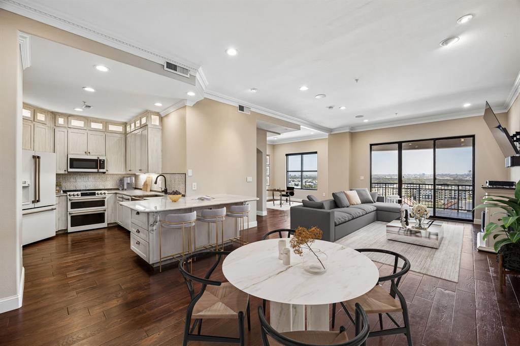 Elevated on the 13th floor, this stunning condominium showcases spectacular sunrises and panoramic vistas of Lake Carolyn through expansive floor-to-ceiling windows, filling the space with natural light. The open-concept design seamlessly blends living, dining, and kitchen areas—ideal for both refined entertaining and effortless everyday living.The updated kitchen features sleek cabinetry, premium appliances, and generous counter space, while the spacious primary suite provides a serene retreat and ample storage in walk in closet. Enjoy resort-style amenities, secure access, two assigned parking spots, two large, on-site storage units - approximately 8ft x 14ft each and a true lock-and-leave convenience. Ideally positioned near the iconic The Ritz-Carlton Las Colinas, Dallas  and just minutes from Dallas-Fort Worth International Airport - this residence offers unmatched accessibility for both business and leisure travel. Golf enthusiasts will also appreciate the proximity to Las Colinas Country Club adding another layer of luxury to the lifestyle.  With dining, entertainment, and the scenic Mandalay Canal just steps away, this is high-rise living at its finest!  24 hour concierge, business center, rooftop pool and gym!