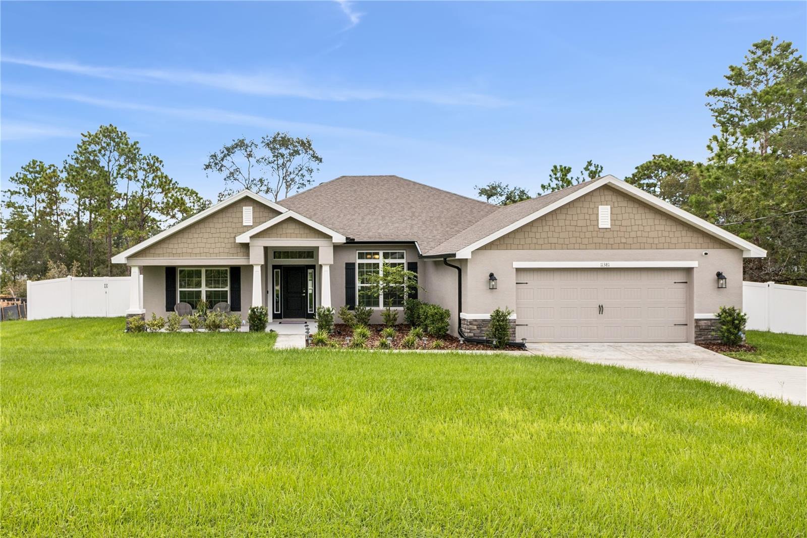 Welcome to a home that blends comfort, style, and thoughtful design. This 4-bedroom, 3-bath home with a versatile flex room offers over 2,500 square feet of beautifully crafted living space on just under half an acre.

From the moment you enter, you’re greeted by an open, light-filled layout with tile flooring flowing seamlessly through the main living areas. At the heart of the home, a custom-built entertainment wall sets the tone for effortless gatherings and relaxed evenings.

The kitchen is both functional and stunning, with expansive counter space, modern finishes, and an easy connection to the dining and living spaces—perfect for both entertaining and everyday living.

The primary suite is a private retreat, featuring tray ceilings, dual vanities, a soaking tub, and a separate walk-in shower. Three additional bedrooms and two full baths provide comfort and privacy for family or guests, while the flex room offers endless possibilities as an office, gym, or guest suite.

Step outside to a backyard designed with potential in mind. The lot has been mostly cleared and fully enclosed with vinyl fencing, creating both privacy and a blank canvas for a future pool or garden. A utility shed adds convenience for storage and organization.

Perfectly located near shopping centers, grocery stores, restaurants, movie theaters, and more, this home combines privacy with everyday convenience.

Every detail has been carefully considered, allowing you to enjoy the feel of new construction without the wait. This smart home is truly move-in ready.