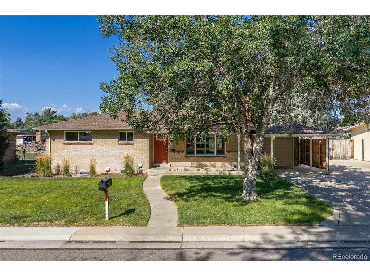 Just minutes from Sloan's Lake, Crown Hill Trails, shopping, dining, and major commuter routes, you can enjoy all that west Denver has to offer! Peacefully situated on a quiet cul-de-sac and set on nearly a quarter acre, this beautifully maintained 4-bedroom, 2-bath home offers the perfect blend of space, character, modern updates, and convenience.  Inside, timeless mid-century charm meets thoughtful updates, with original wood floors, a cozy wood-burning fireplace, and an updated kitchen that flows seamlessly into the bright dining area overlooking the backyard. The outdoor space truly sets this home apart, featuring a large covered patio, professional landscaping, raised garden beds, an irrigation well, and a brick terrace featuring a natural gas fire pit. Perfect for entertaining or enjoying Colorado evenings. The fully finished basement adds incredible versatility with two additional bedrooms, an updated bathroom, new LVP flooring, spacious living area, and a large laundry room with a utility sink and ample storage. From its unbeatable location and thoughtfully updated spaces to recently updated major systems and a backyard designed for entertaining and enjoying Colorado living, this home truly has it all!