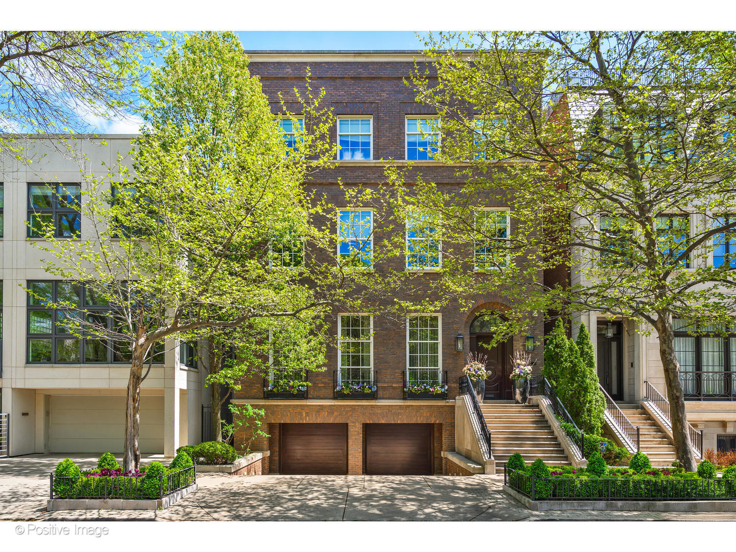 Set on an expansive 44-ft-wide lot on the most coveted block of one of Chicago's most prestigious streets, 1853 N Burling is an exceptional custom-built estate. Situated in the heart of Lincoln Park, this architectural tour de force seamlessly combines masterful craftsmanship & refined modern living. Designed for extraordinary living, every element of this home has been carefully curated to reflect enduring quality & timeless elegance. The home's distinguished facade is defined by hand-selected, water-struck custom brick, triple-hung windows, & a grand arched entry crowned by a handcrafted S.A. Baxter decorative doorknob. Upon entering, an elegant foyer & gallery hall unfold, w/generous wall space ideal for showcasing a fine art collection. Designed for effortless living, the home includes a full-service elevator that provides seamless access to all levels. A graciously sized formal living room impresses w/soaring 11-ft ceilings & a gas fireplace. Floor-to-ceiling windows frame picturesque tree-lined views, bathing the space in natural light. An adjacent formal dining room provides the perfect setting for both intimate dinners & large-scale entertaining. A jewel box of design, a powder room stuns w/Venetian plaster walls & a custom Macassar ebony vanity topped in glass. At the heart of the home is a Christopher Peacock-designed kitchen, a true statement in luxury and functionality. Outfitted w/marble slab countertops, Wolf, Sub-Zero, Bosch, & Broan appliances, & an oversized breakfast bar, the space is complemented by a fully appointed butler's pantry, featuring a 2nd dishwasher, Wolf warming drawer, Miele coffee station, & steam oven. The adjoining family room centers around a gas fireplace & opens to a light-filled breakfast room framed by French doors. These doors lead to a Saint Andrew's stone terrace with a built-in grill, overlooking the professionally landscaped grounds by J.W. Landscapes, complete w/custom sport court. A sculptural, curved staircase connects the upper levels, crowned by a domed skylight w/custom lens & a Bocci chandelier, casting a soft glow. The artisan-forged metal balustrade introduces architectural rhythm to the space. The primary suite is a serene retreat wrapped in fine millwork & thoughtful detail. The paneled sitting room w/custom cabinetry doubles as a sophisticated home office. In the bedroom, a gas fireplace & high ceilings create a sense of grandeur, while French doors open to a private terrace overlooking a manicured garden. Bathed in natural light, the spa-inspired bath features an oversized steam shower, soaking tub, mahogany vanity w/Calcutta marble, Lefroy Brooks fixtures, heated marble floors, & pocket doors. A richly appointed mahogany dressing room w/integrated cabinetry & a dedicated packing station completes the suite. A professionally outfitted exercise room completes this level with full-height mirrors & reinforced rubber flooring for sound & stability protection. The 3rd level hosts 3 ensuite bedrooms, each filled w/natural light & custom built-ins. A charming library w/built-in shelving, a rolling ladder, & a large walk-in closet-already plumbed for a future bath-provides flexibility for a creative space or an additional bedroom. The laundry room features Electrolux washer & dryer, ample cabinetry, & marble countertop workspace. Ascend to the rooftop to take in panoramic skyline views, where a firepit, lounge seating, & outdoor dining space create the ultimate setting for alfresco living. The lower level offers radiant heated floors, a spacious recreation room, a custom wet bar, climate-controlled wine cellar, guest suite, full bath, & a mudroom that connects directly to the attached, heated 2.5-car garage. Enhancing daily comfort, the home is equipped w/snowmelt system for the driveway, steps, & sidewalks. Designed to enhance everyday living, this residence includes a full irrigation system, outdoor landscape lighting, a state-of-the-art security system, & built-in speakers.