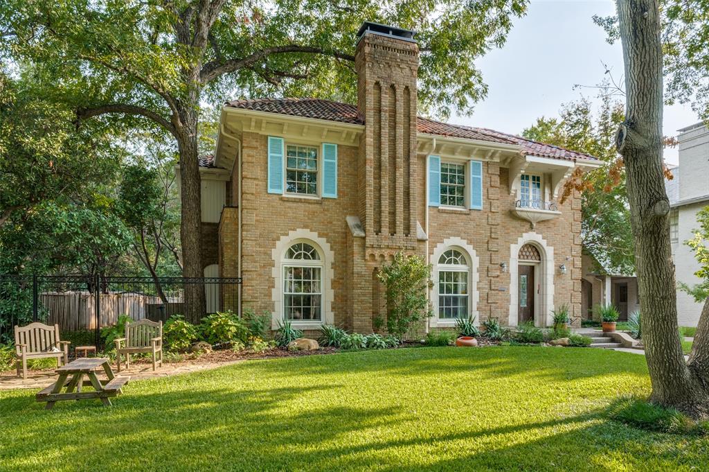 Situated on one of Dallas’ most cherished streets, this historic three bedroom, three and a half bath Lakewood Boulevard residence is a rare gem that blends timeless architecture with thoughtful modern updates. Nestled on a large lot with manicured mature trees. Steeped in character and charm, the home features original details throughout—including large, vibrant stained glass windows that bathe the interior in color and light and a Rookwood tile Fireplace with gas logs in the Formal Living Room.
A spacious eat-in kitchen offers both function and comfort, perfect for casual meals or morning coffee, while a separate formal dining room provides an elegant setting for entertaining. All the rooms are oversized with beautiful hardwood floors.
The Library features arched windows, built-in bookshelves and cabinets. Upstairs, beautifully appointed bedrooms and classic period details continue the home's vintage charm. The property features a detached garage with private quarters (642 sq ft) that include a full bath and balcony above—ideal for guests, an office, or studio space.

All just moments from White Rock Lake, Lakewood Country Club, Whole Foods, Restaurants, shopping and Lakewood Elementary, this is your opportunity to own a piece of Dallas history in one of the city’s most iconic neighborhoods.