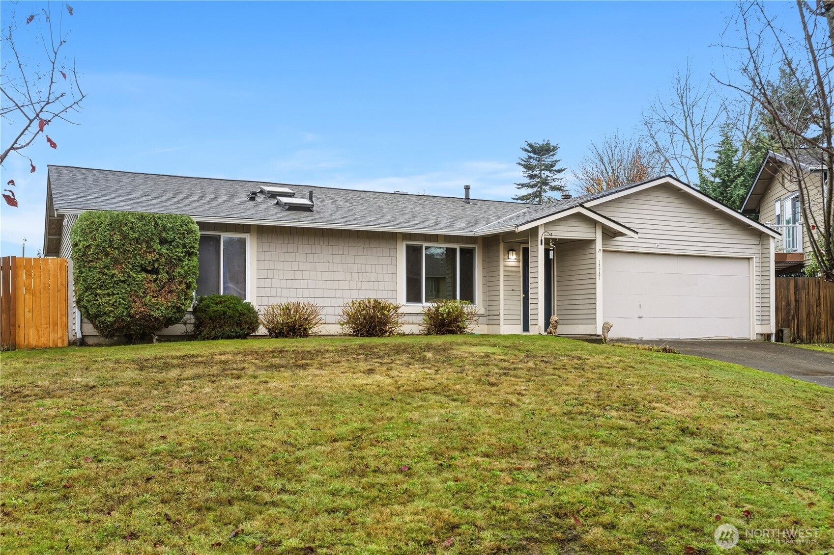 Welcome Home! This 3 bed, 2 full bath rambler sits on a roomy corner lot and offers a blend of features to enjoy: newer roof, 2-car garage,  and dedicated RV parking. The fully fenced yard provides a private hot tub retreat, perfect for unwinding after a long day.  Indoors, the wood fireplace creates a warm gathering spot during cooler months. Close to parks, schools, and shopping, this  home offers space and potential in a well-located neighborhood.