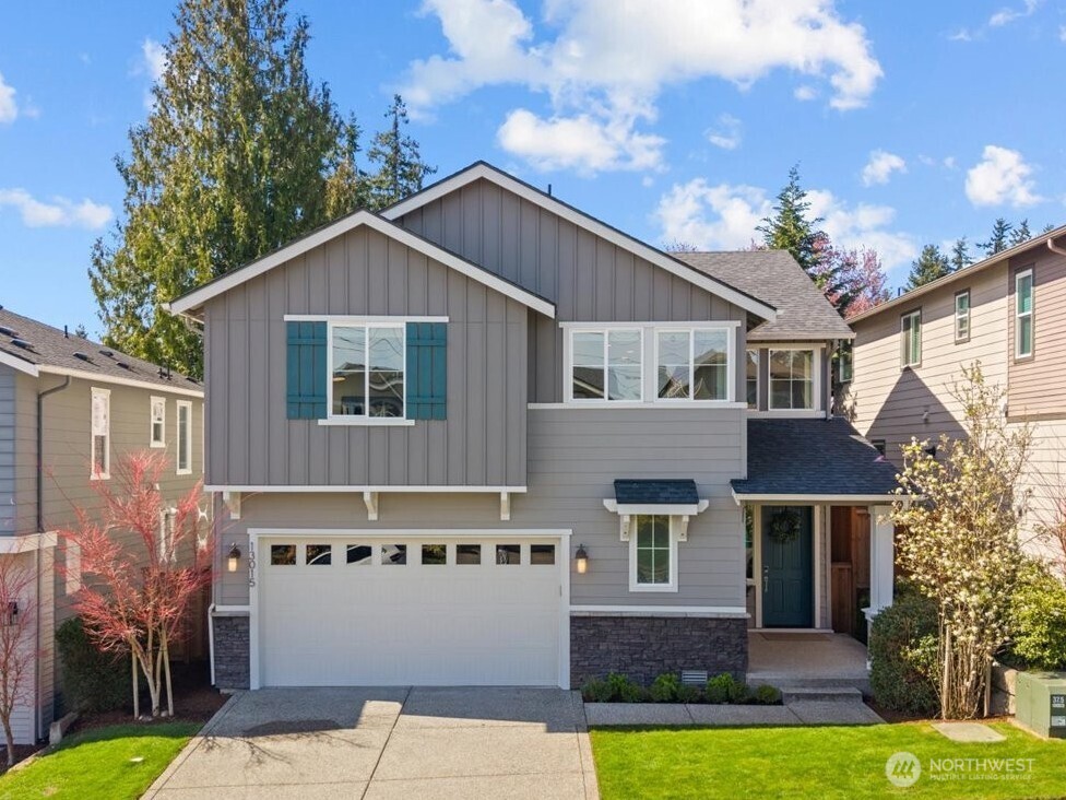 Tucked away on a quiet cul-de-sac in the desirable Vintners Place community, this move-in ready home offers the perfect blend of modern design, flexible living space, and unbeatable Eastside convenience, just minutes to Totem Lake Village, Redmond, and major tech campuses. The main level is designed for today’s living, featuring an open-concept great room with 9-foot ceilings, rich wood flooring, and seamless flow. The chef’s kitchen is the heart of the home, complete with a large island, quartz countertops, full-height tile backsplash, pot-filler and stainless appliances including a gas cooktop, ideal for both everyday living and entertaining. Additional highlights include a cozy gas fireplace and thoughtful finishes throughout. Upstairs, wake up to beautiful Cascade Mountain sunrises and enjoy a versatile loft space perfect for a home office, media room, or additional lounge area. The private primary suite offers a peaceful retreat with a spacious walk-in closet and a well-appointed en-suite bath featuring a soaking tub and tile shower. Step outside to a covered patio and low-maintenance yard, perfect for year-round relaxation. Located in a well-maintained community with green spaces, walking trails, playground, and dog park, this home offers a lifestyle that’s both connected and convenient. Highly regarded Lake Washington School District. Pre-inspected and meticulously maintained, this is a rare opportunity to own a newer Kirkland home in a prime location.