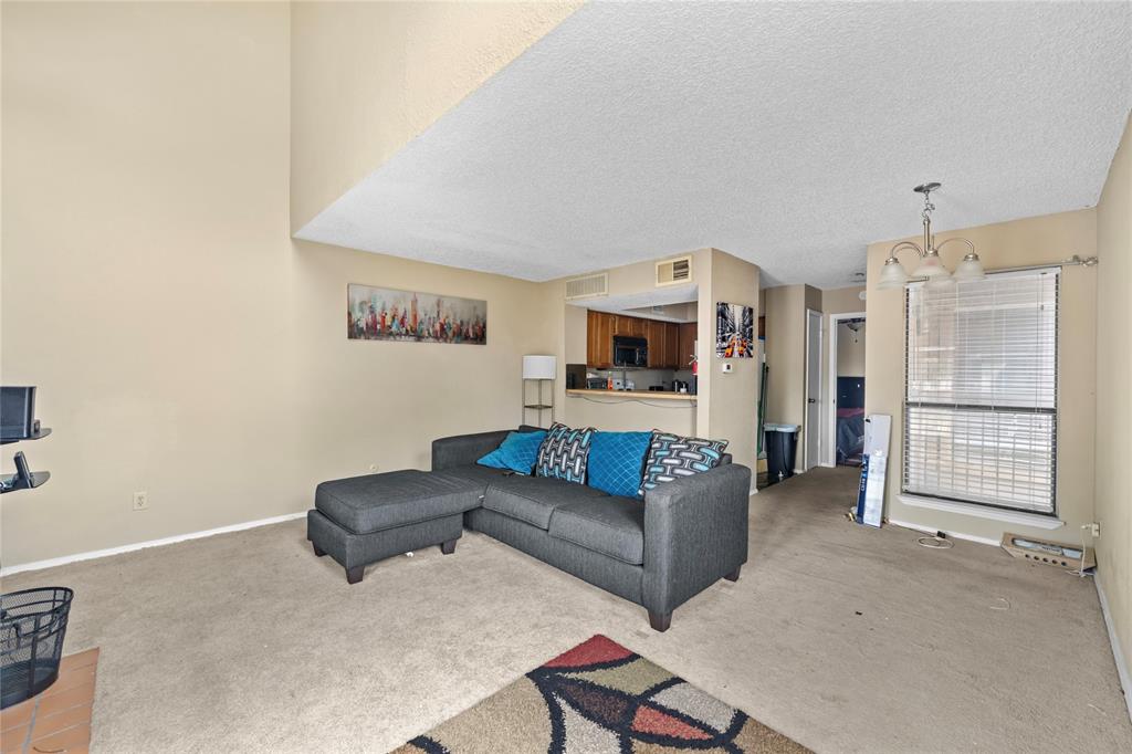 Move-in ready upstairs condo in the Richland Trace community, with easy access to 635, 75, shopping centers, and Dallas College Richland Campus. Newer paint and carpet, and a modern kitchen countertop , a cozy coffee bar, and all appliances included. The living room offers a wood-burning fireplace and built-in bookcase, while the spacious bedroom boasts a walk-in closet, full bathroom, and in-unit laundry. Conveniently located near the clubhouse and pools, this condo is perfect for students or families looking for comfort and value—don’t miss it!