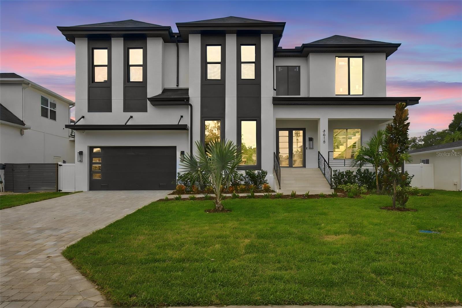 3615 S Lightner Avenue, a brand-new luxury residence in coveted Bel Mar Shores offering 4,859 heated square feet, exceptional construction, and some of the best indoor-outdoor living South Tampa has to offer. Designed with South Tampa living in mind, the home features an elevated foundation design and reinforced construction throughout, pairing quality craftsmanship with an elevated aesthetic. Every finish, fixture, and material has been hand-selected by a designer, creating a home that feels cohesive, sophisticated, and incredibly well curated.From the moment you enter, this home makes a statement. A grand entrance opens to expansive living spaces, an impressive open dining area, and a beautifully designed kitchen with two separate pantry spaces, all flowing effortlessly together. An oversized two-car garage features soaring ceilings with the ability to accommodate car lifts, offering additional flexibility for vehicle storage.But the real showstopper is the entertaining space. The first floor opens to a massive covered indoor-outdoor living area, oversized pool, and fully equipped outdoor kitchen with high-end appliances. Upstairs, a spacious loft leads to a second expansive covered patio overlooking the backyard, giving you yet another incredible place to entertain or unwind.The primary suite is equally impressive, complete with a dream closet featuring custom built-ins, beautiful uplighting, and a gorgeous quartz island.Beyond the design, plans call for reinforced 8-inch CMU along the first-floor load-bearing walls, reinforced concrete footings and slab, structural steel components, and engineered framing. Minutes from Bayshore Boulevard, Hyde Park, Downtown Tampa, Tampa International Airport, and some of South Tampa's best dining and shopping, 3615 S Lightner isn't just another new build. It's a home designed to make an impression and made to entertain.