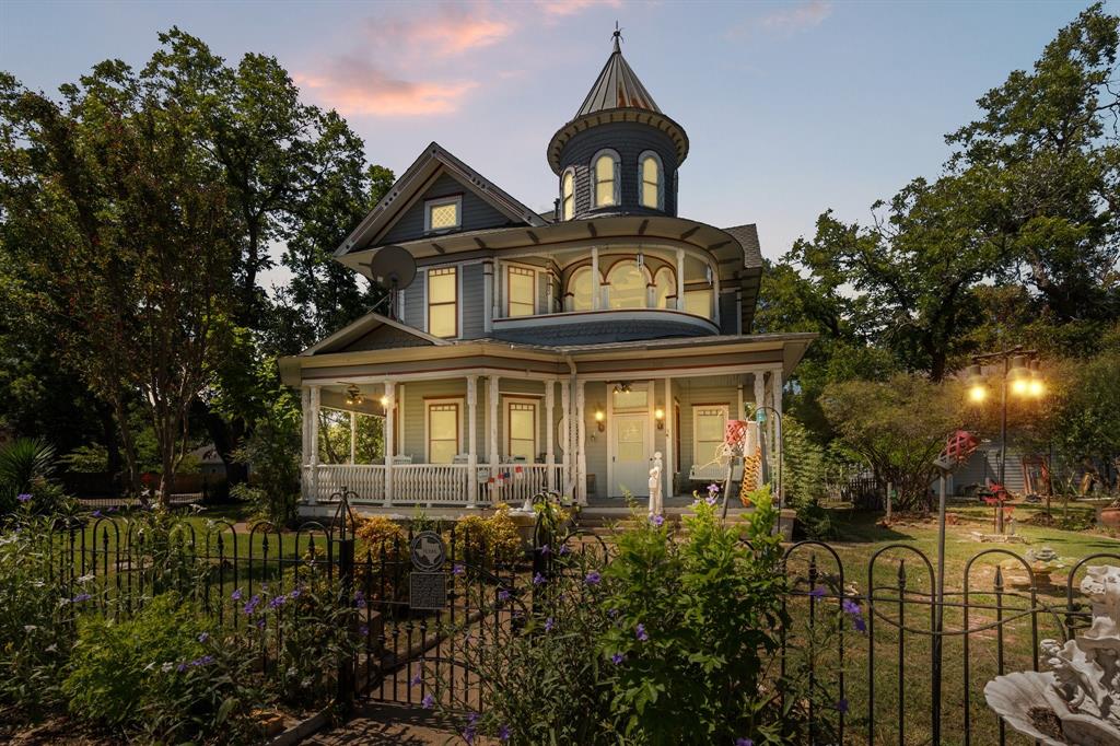 For 125 years, this stunning Victorian home has been the talk of the town and now it’s ready for a new chapter. Overflowing with timeless character, this 3-bedroom, 2-bath property has over 3,000 square feet of space, including both formal and informal living areas, a spacious dining room, and an updated kitchen. One of the upstairs bedrooms opens onto a balcony with beautiful views, the perfect spot to relax and unwind.
Outside, you'll love the wrap-around Southern-style porch, decorative fencing, mature trees, and an enclosed yard complete with a sprinkler system. The property also features a 2-story, insulated 4-car garage with a heated and cooled upstairs space perfect for storage, a workshop, or a future apartment conversion. This home has solid bones and many updates already completed—it just needs a little love and your personal touch to make it truly shine.