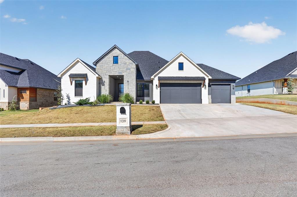 Built in 2024 in Morgan Creek, this thoughtfully designed home offers 3,013 square feet of single-level living with 3 bedrooms, 4 full baths, a study and a versatile media/bonus room. White brick, stone accents and custom landscaping set the tone for the warm, modern interiors. Cathedral ceilings with a wood beam rise above the open living area, anchored by a quartz-accented fireplace and oversized arched built-ins. Wood-look tile, distinctive lighting and rich wood accents add character throughout. The kitchen features quartz countertops, a generous island with seating and a workstation sink, gas cooktop, double ovens, custom pull-outs, and soft-close drawers and doors. An open pantry with an appliance hutch provides exceptional storage and prep space. The secluded primary suite offers an illuminated tray ceiling and a spa-inspired bath with dual sinks, a freestanding soaking tub, and a glass shower with a bench. A spacious walk-in closet with built-in storage connects directly to the laundry room. Additional bedrooms have access to private baths, while the study provides a dedicated workspace. The media/bonus room features built-in cabinetry and direct patio access. A separate utility area includes a built-in desk, enclosed hall tree, storage bench and pet-washing station. Enjoy outdoor gatherings on the spacious covered patio with a ceiling fan and professionally installed paver extension overlooking the fenced backyard. Added features include a high-end security system, tankless hot water, zoned heating and cooling, and a sprinkler system. The attached three-car garage includes a rear door for convenient backyard access. Beautiful finishes and practical details make this home as comfortable as it is inviting.